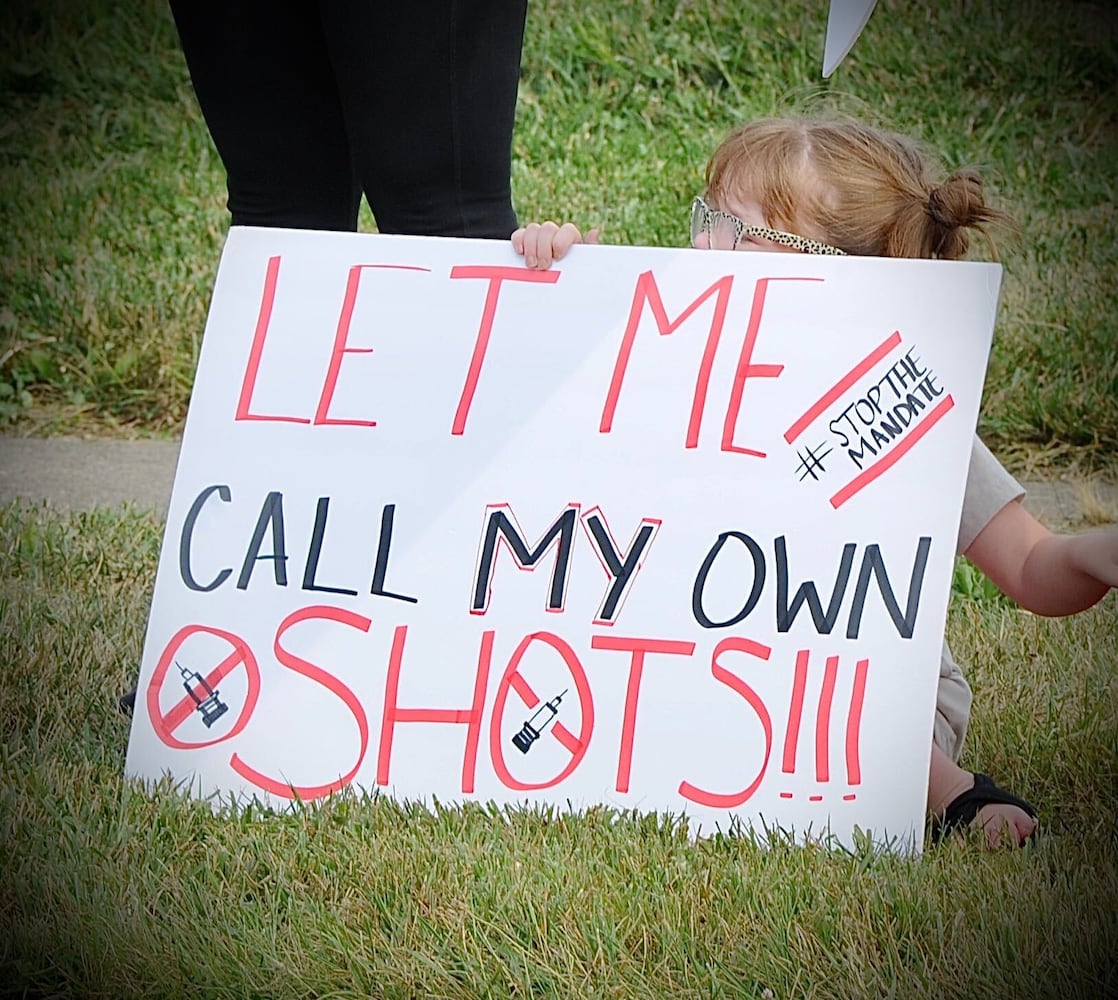 PHOTOS: Crowd gathers to protest COVID vaccine at Kettering Health