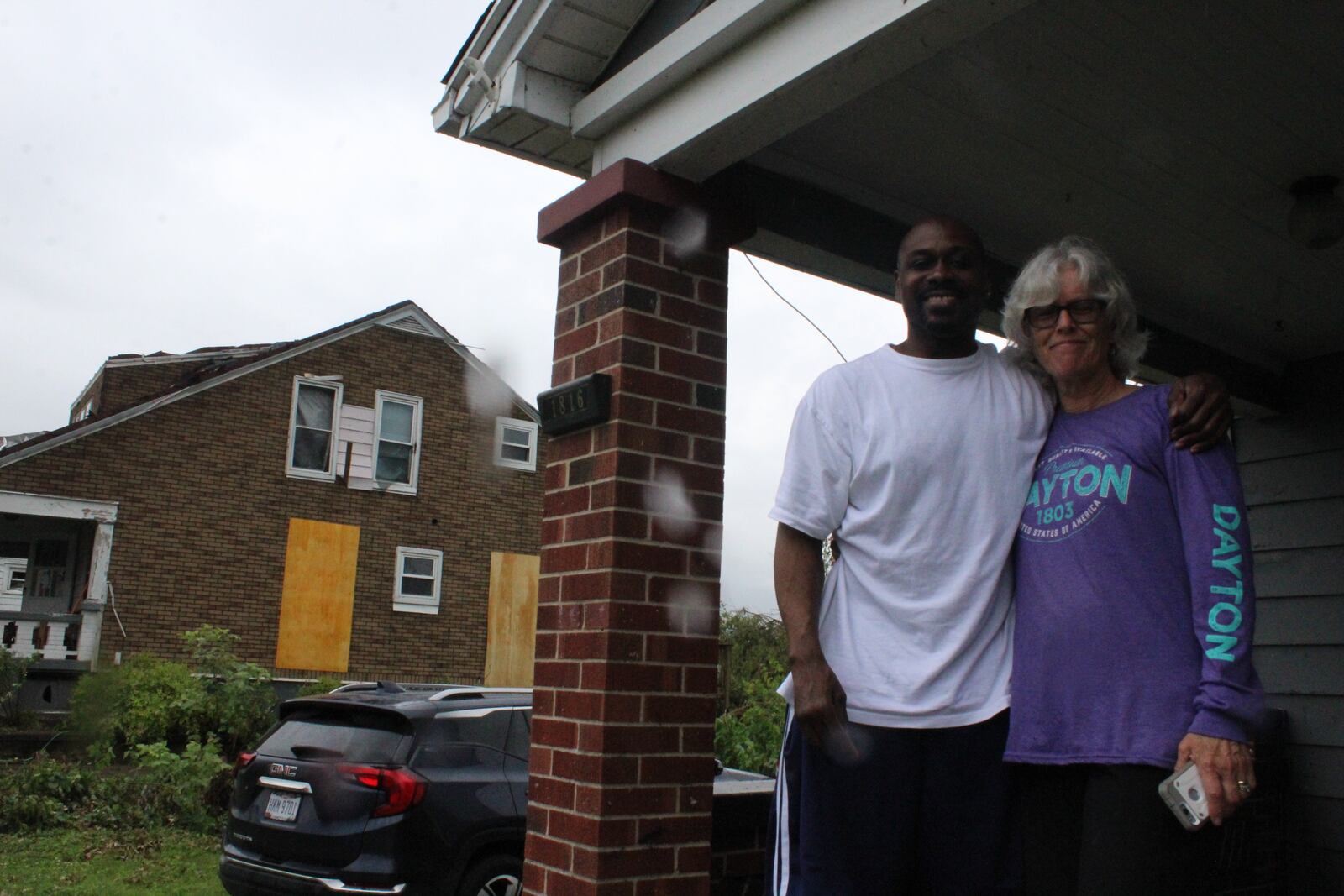 Robin Sassenberg and her neighbor Latrell Turner at her home after the tornado struck. Photos by Amelia Robinson