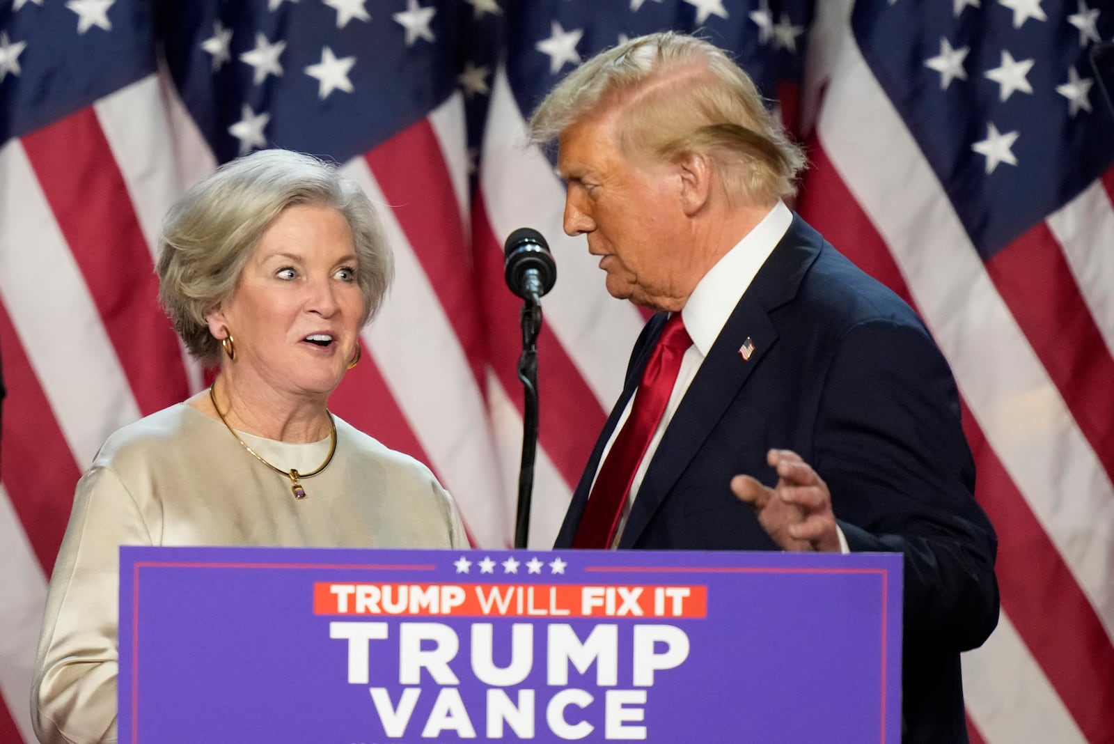 Republican presidential nominee former President Donald Trump brings Susie Wiles to the podium at an election night watch party Wednesday, Nov. 6, 2024, in West Palm Beach, Fla. (AP Photo/Alex Brandon)