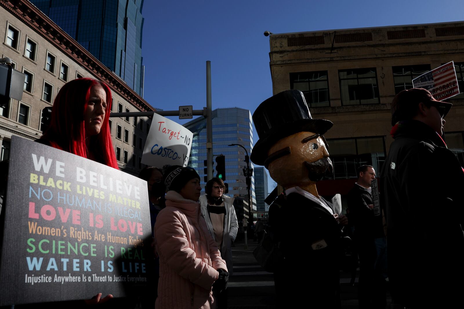 Community members listen during a news conference organized by Black Lives Matter Minnesota outside Target Corporation's headquarters Thursday, Jan. 30, 2025, in Minneapolis, Minn. (AP Photo/Ellen Schmidt)