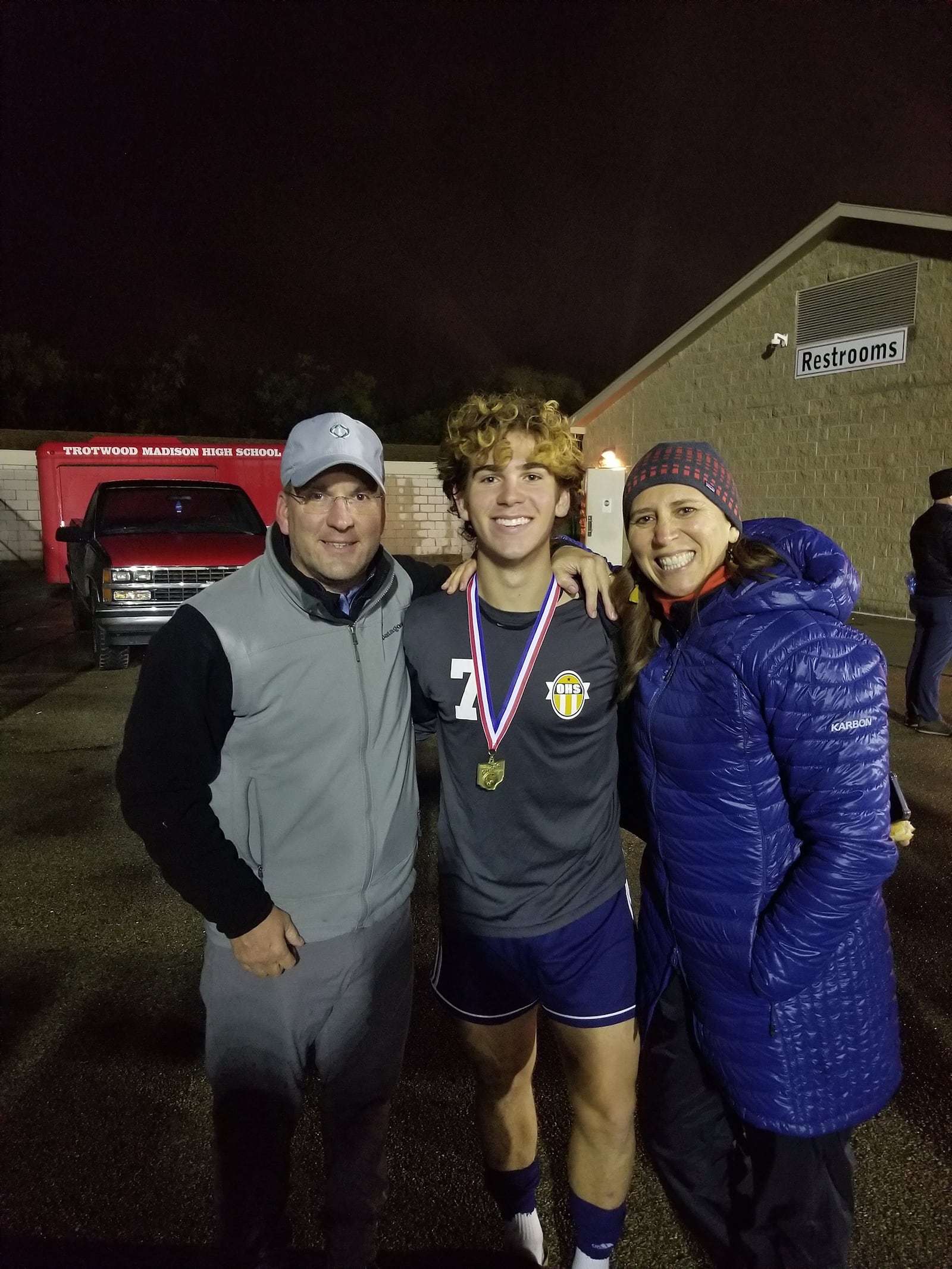 Vince Russell, left, with son Vito, now 19, and wife Maria, right, at an Oakwood High School soccer game in Trotwood. Vince also volunteered at his children's schools to help teachers and students learn about the stock market. CONTRIBUTED