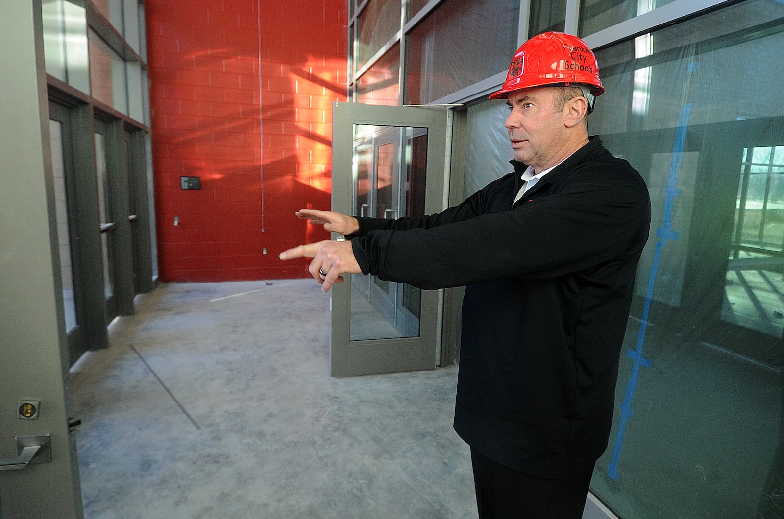 Superintendent Michael Sander talks about the new secure entryway into the new Franklin High School located on East Sixth Street. MARSHALL GORBY\STAFF