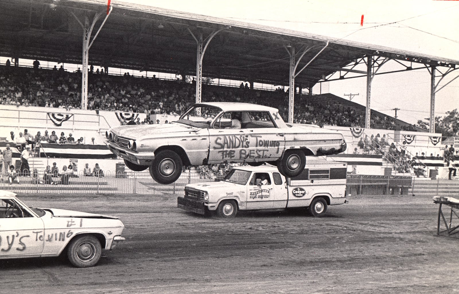 Cars race around the track at the Montgomery County Fairgrouds in 1975. DAYTON DAILY NEWS ARCHIVE