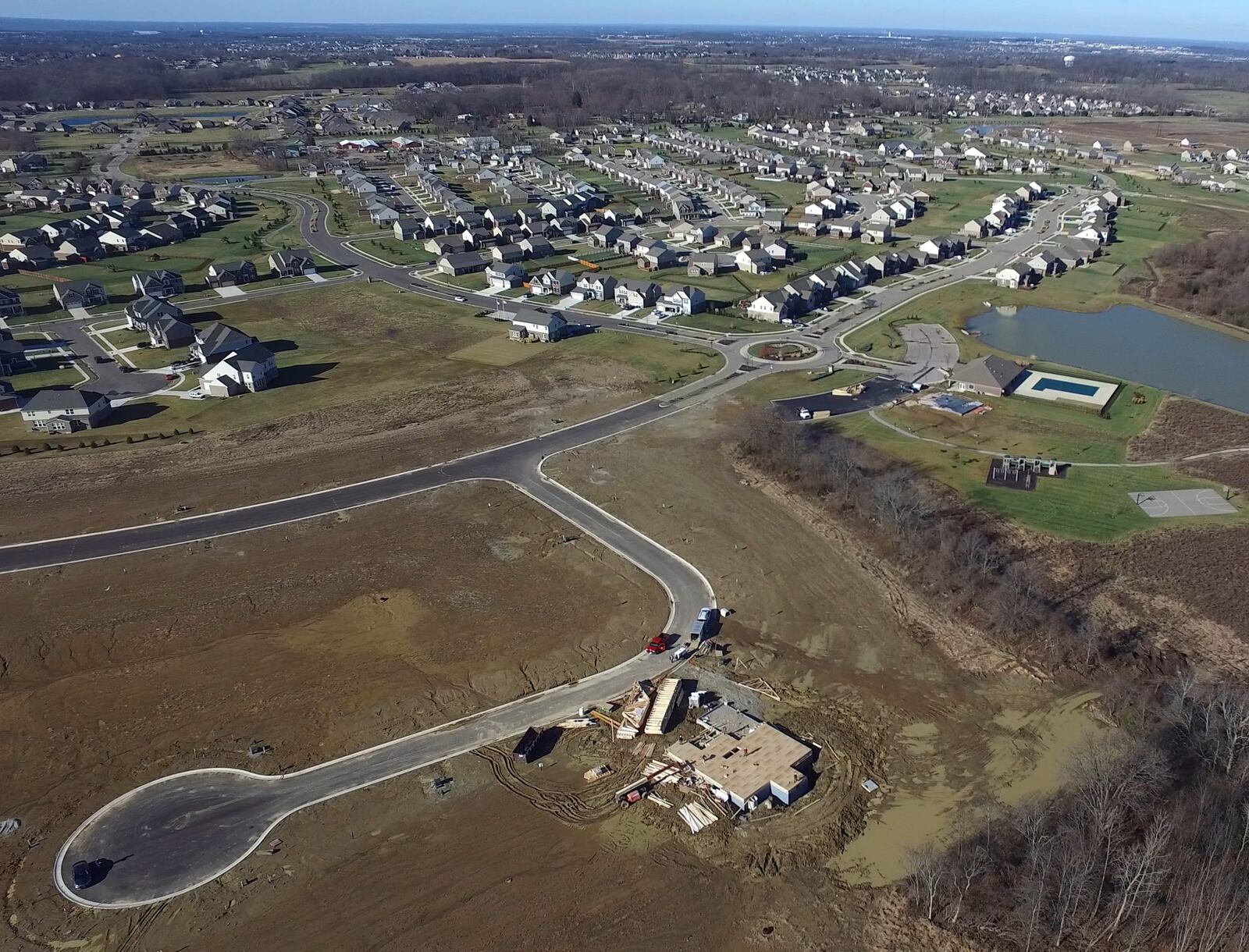 A new home is under construction on Sunny Brook Drive in the Villages of Winding Creek along State Route 48 on the border of Montgomery and Warren Counties . TY GREENLEES / STAFF