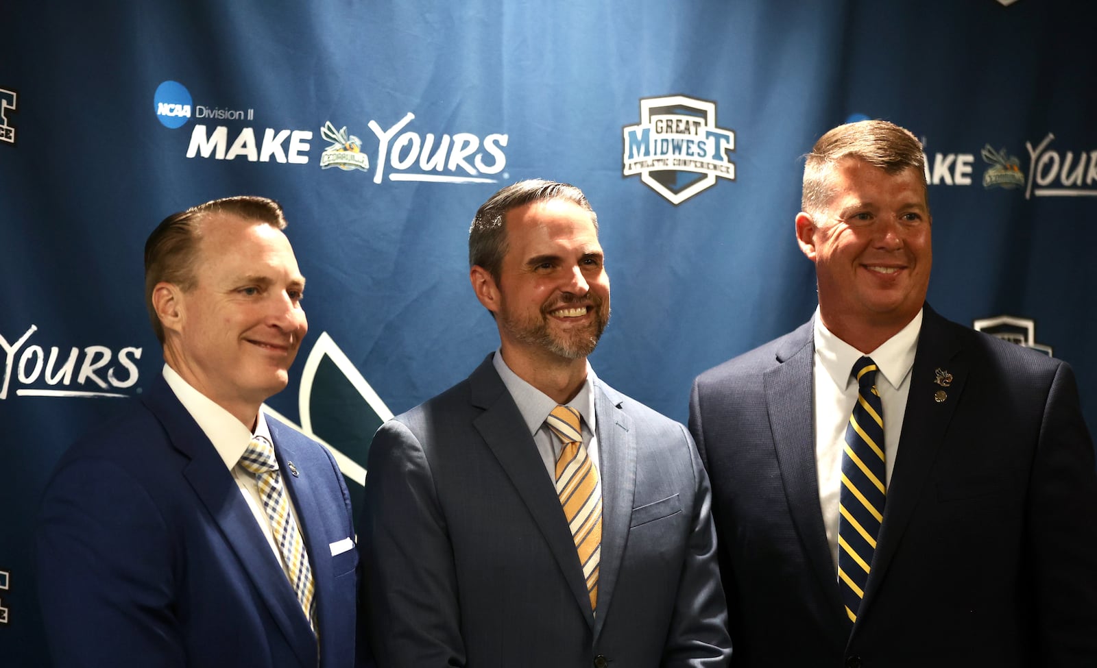 Cedarville University President Thomas White, new men's basketball coach Rob Jones and Athletic Director Chris Cross pose for a photo at a press conference where Jones was introduced on Tuesday, Aug. 20, 2024, at the Callan Athletic Center in Cedarville. David Jablonski/Staff