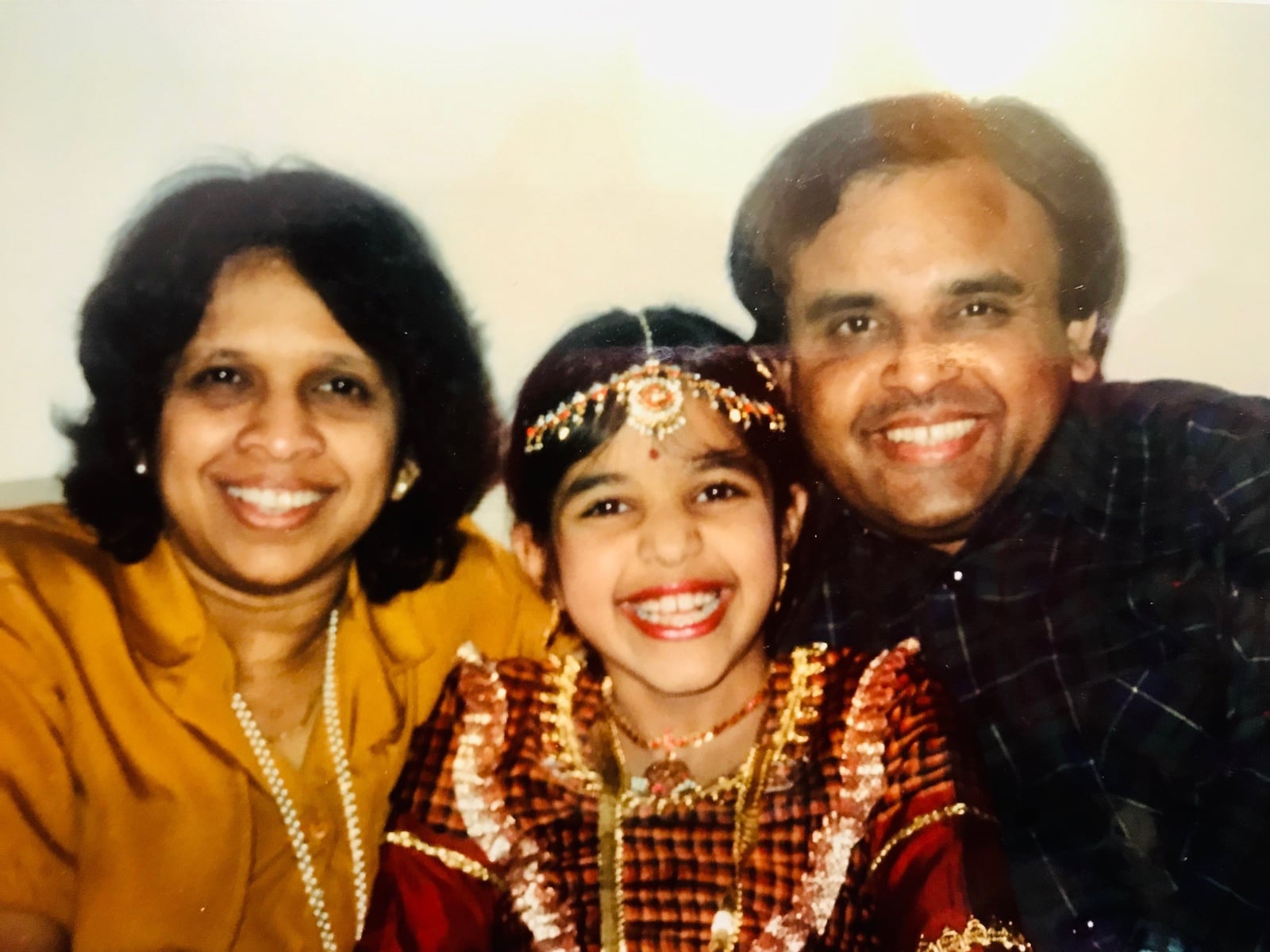 Dr. Luxme Hariharan, now the new Chief of Ophthalmology and Chief Population Health officer at Dayton Children’s Hospital, as a little girl with her mom, Nithya, and her dad,Hari, after the family moved to the United States from India. CONTRIBUTED