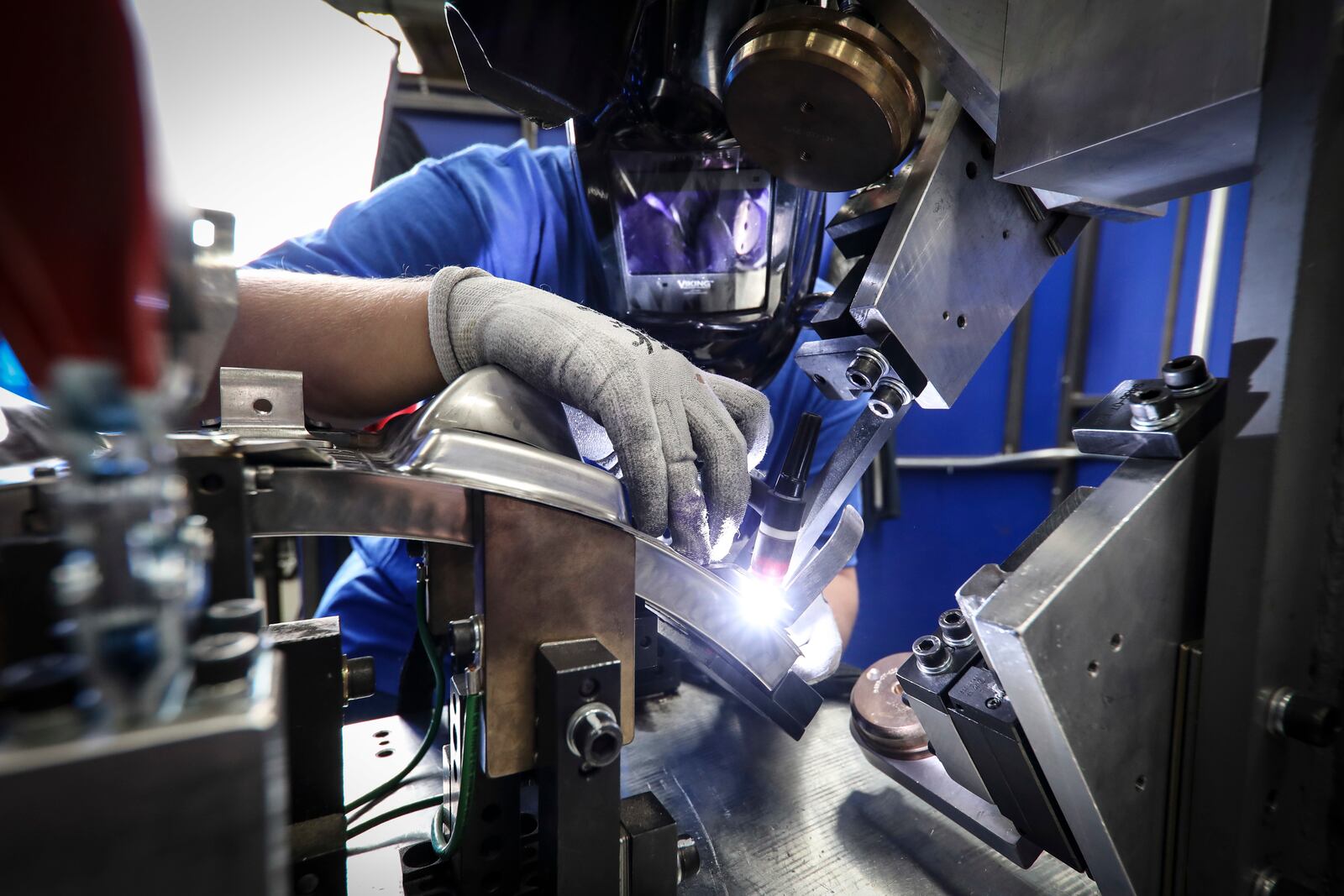 An aerospace welder at work at GE Aviation/Unison in Beavercreek. Contributed