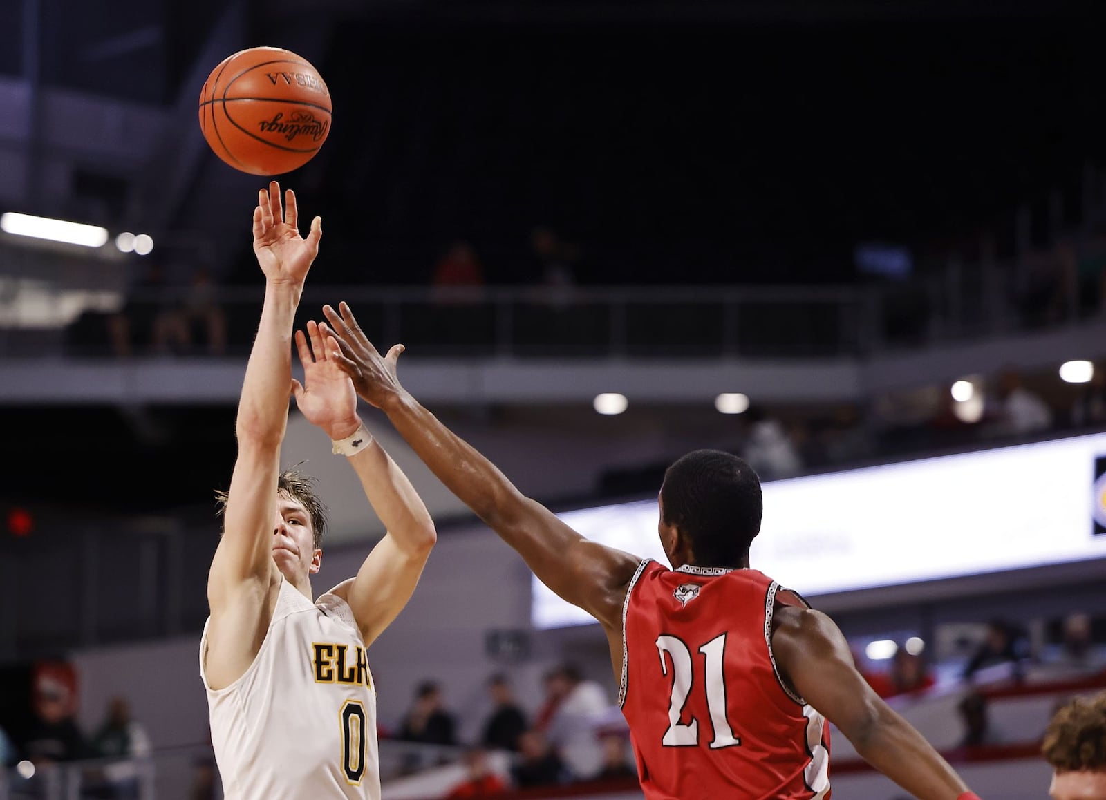 Centerville's Gabe Cupps puts up a shot over Lakota West's Christopher Barber during their Division I District final basketball game Sunday, March 6, 2022 at Fifth Third Arena on the University of Cincinnati campus. Centerville won 80-53. NICK GRAHAM/STAFF