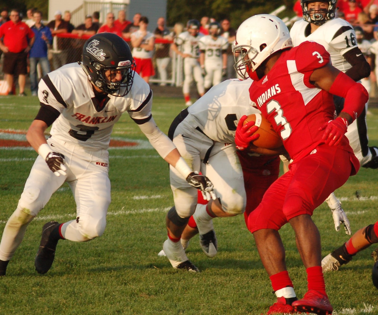 Franklin’s Kyle Rickard (3) moves in to make a tackle on Carlisle’s D.J. Chambers on Friday night during the visiting Wildcats’ 47-14 triumph at Laughlin Field. CONTRIBUTED PHOTO BY JOHN CUMMINGS