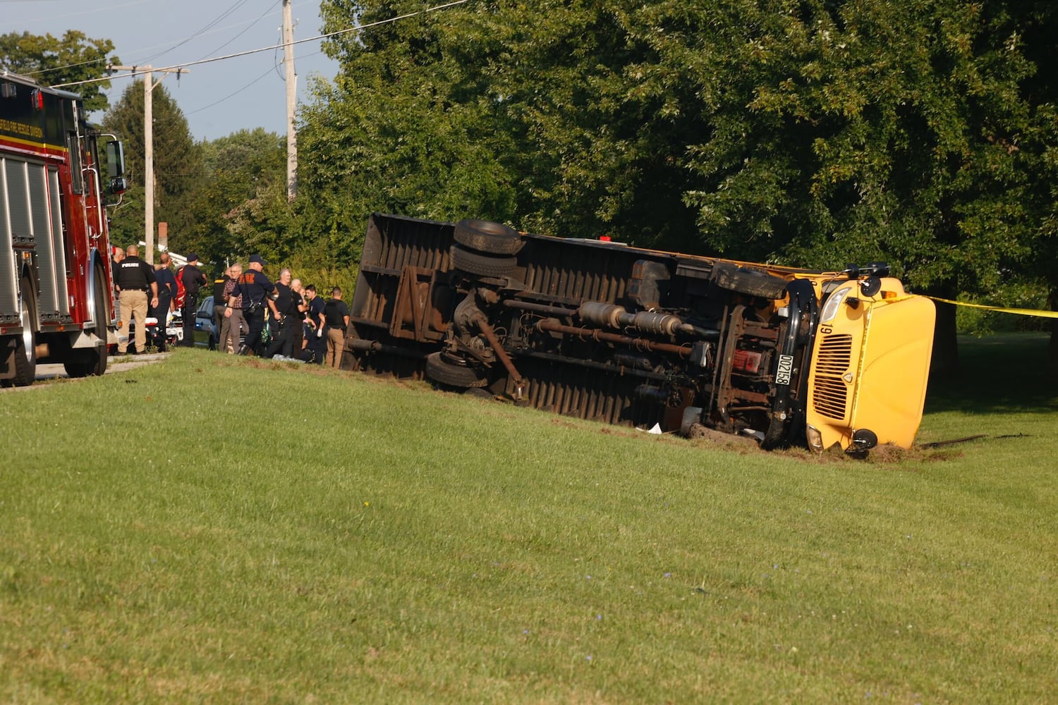 One killed after Northwestern school bus overturns in crash