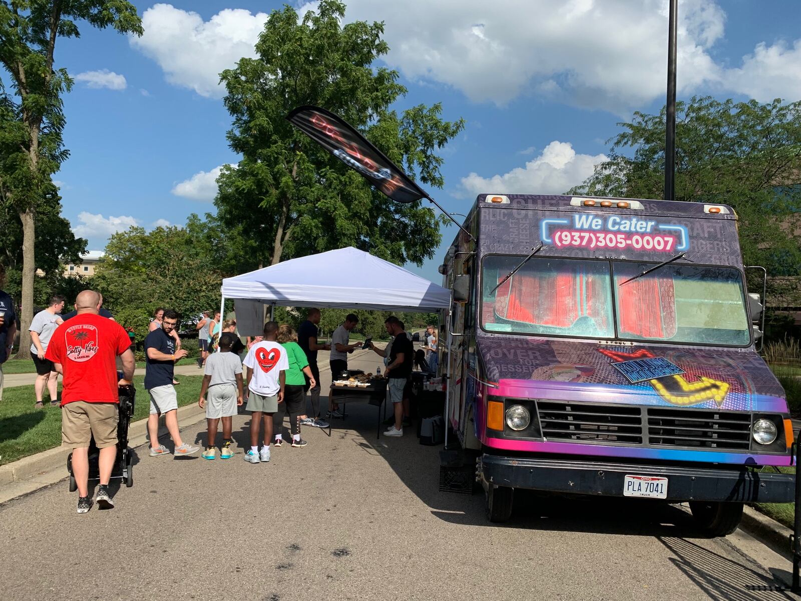 A line of people at the Rolling Indulgence food truck during Bacon Fest at The Fraze. CONTRIBUTED/ALEXIS LARSEN