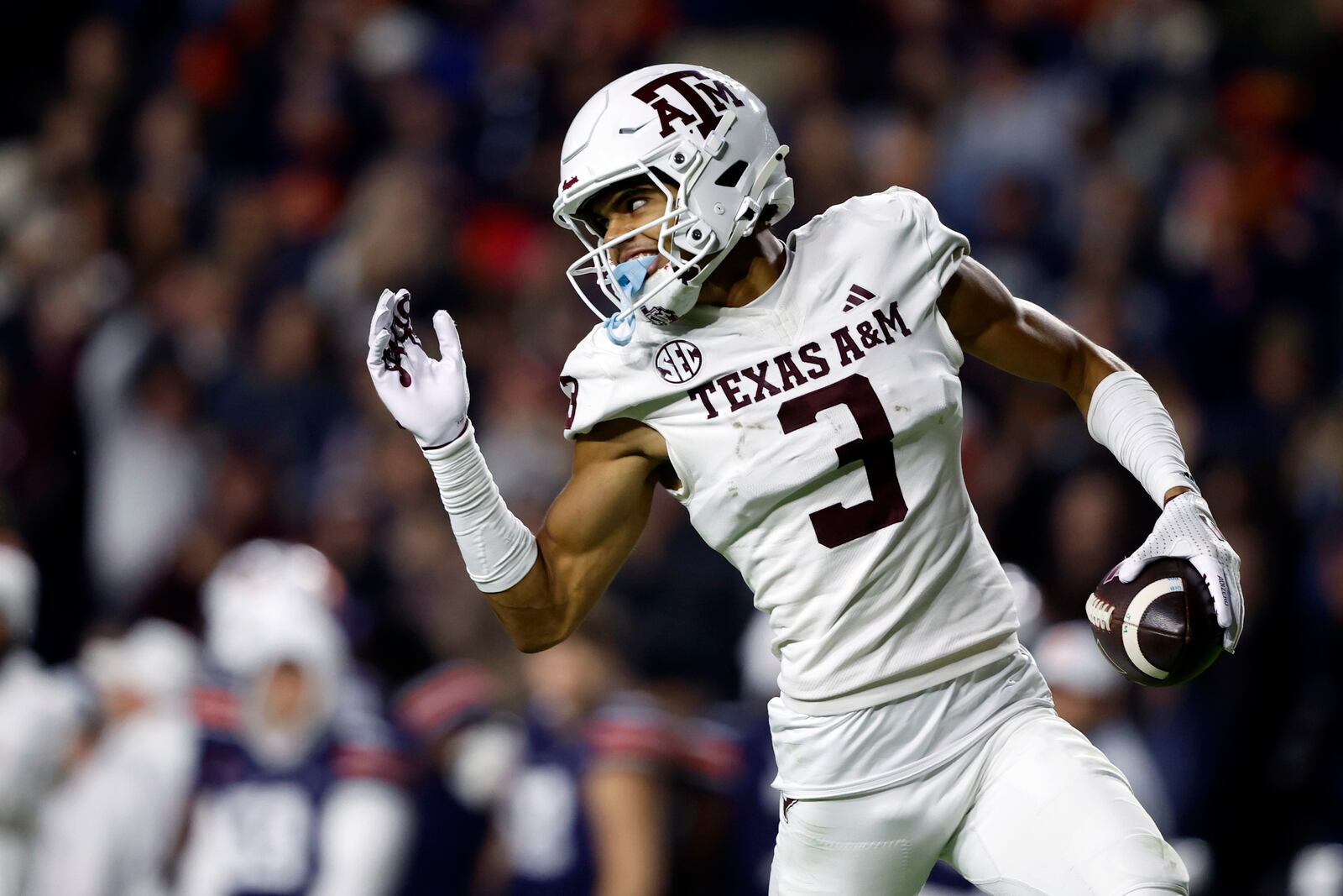 Texas A&M wide receiver Noah Thomas carries the ball in for a touchdown during the second half of an NCAA college football game against Auburn, Saturday, Nov. 23, 2024, in Auburn, Ala. (AP Photo/Butch Dill)