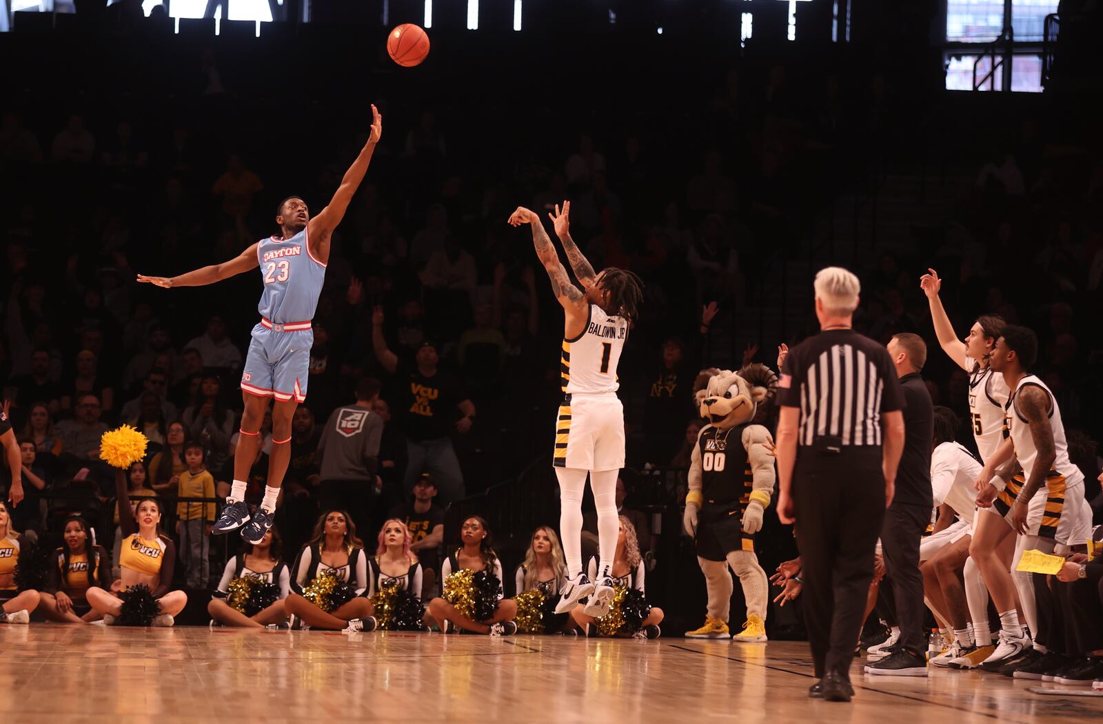 Virginia Commonwealth's Ace Baldwin makes a 3-pointer against Dayton's R.J. Blakney in the Atlantic 10 Conference championship game on Saturday, March 12, 2023, at the Barclays Center in Brooklyn, N.Y. David Jablonski/Staff