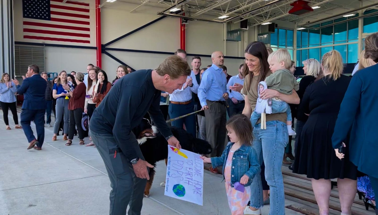 Larry Connor’s 3-year-old granddaughter Colins hands him her “Welcome Home To Earth, Pops” sign late Wednesday afternoon as her mom, Teddi Connor, and Colins' 1-year-old brother Camp join in. Larry returned to Ohio to a surprise welcome from over 100 of the people who work at The Connor Group real estate investment firm he founded, as well as friends, family and the Miamisburg High School band. He had spent 17 days in space as the pilot of the first private, all civilian crew to fly to the International Space Station, where the group conducted 25 experiments and research projects. He also held several outreach programs from space in which he spoke directly to Miami Valley schoolkids. CONTRIBUTED