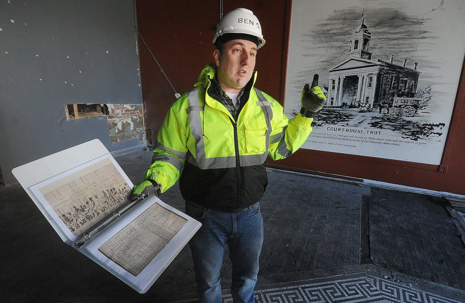 Ben Sutherly gives a tour Wednesday, Feb. 14, 2024 inside the controversial Troy Tavern building, which the Troy Historic Preservation Alliance is trying to save. MARSHALL GORBY\STAFF