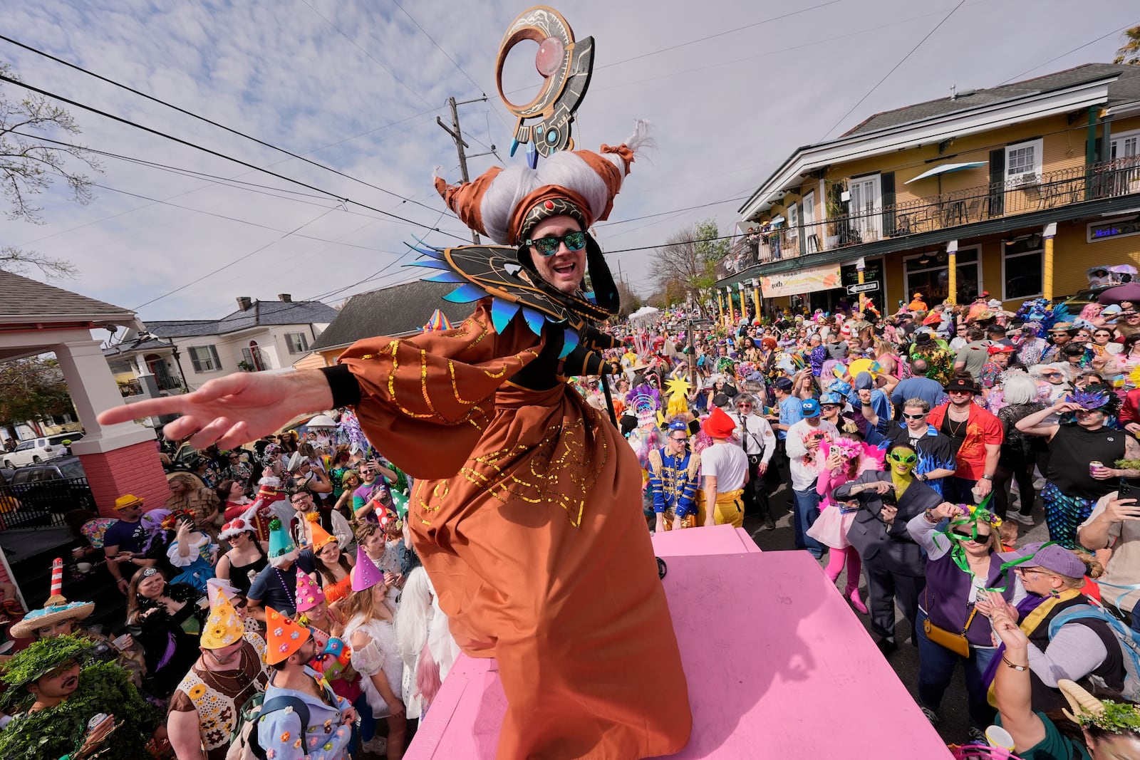 People gather for the start of the Society of Saint Anne's parade on Mardi Gras Day, Tuesday, March 4, 2025 in New Orleans. (AP Photo/Gerald Herbert) (AP Photo/Gerald Herbert)