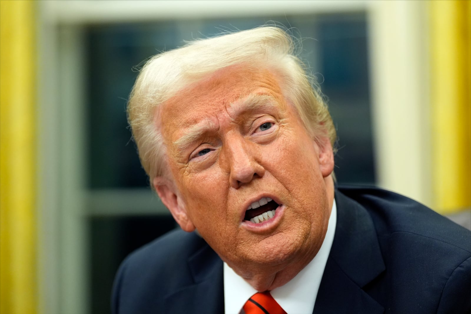 President Donald Trump speaks with reporters as he signs executive orders in the Oval Office at the White House, Monday, Feb. 10, 2025, in Washington. (Photo/Alex Brandon)