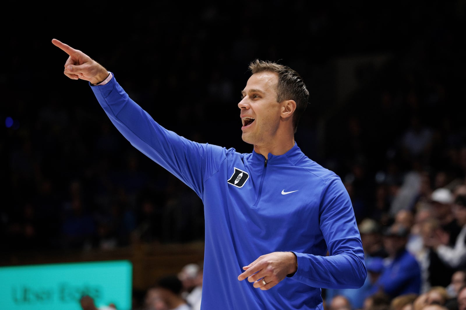 Duke head coach Jon Scheyer directs his team during the first half of an NCAA college basketball game against Maine in Durham, N.C., Monday, Nov. 4, 2024. (AP Photo/Ben McKeown)