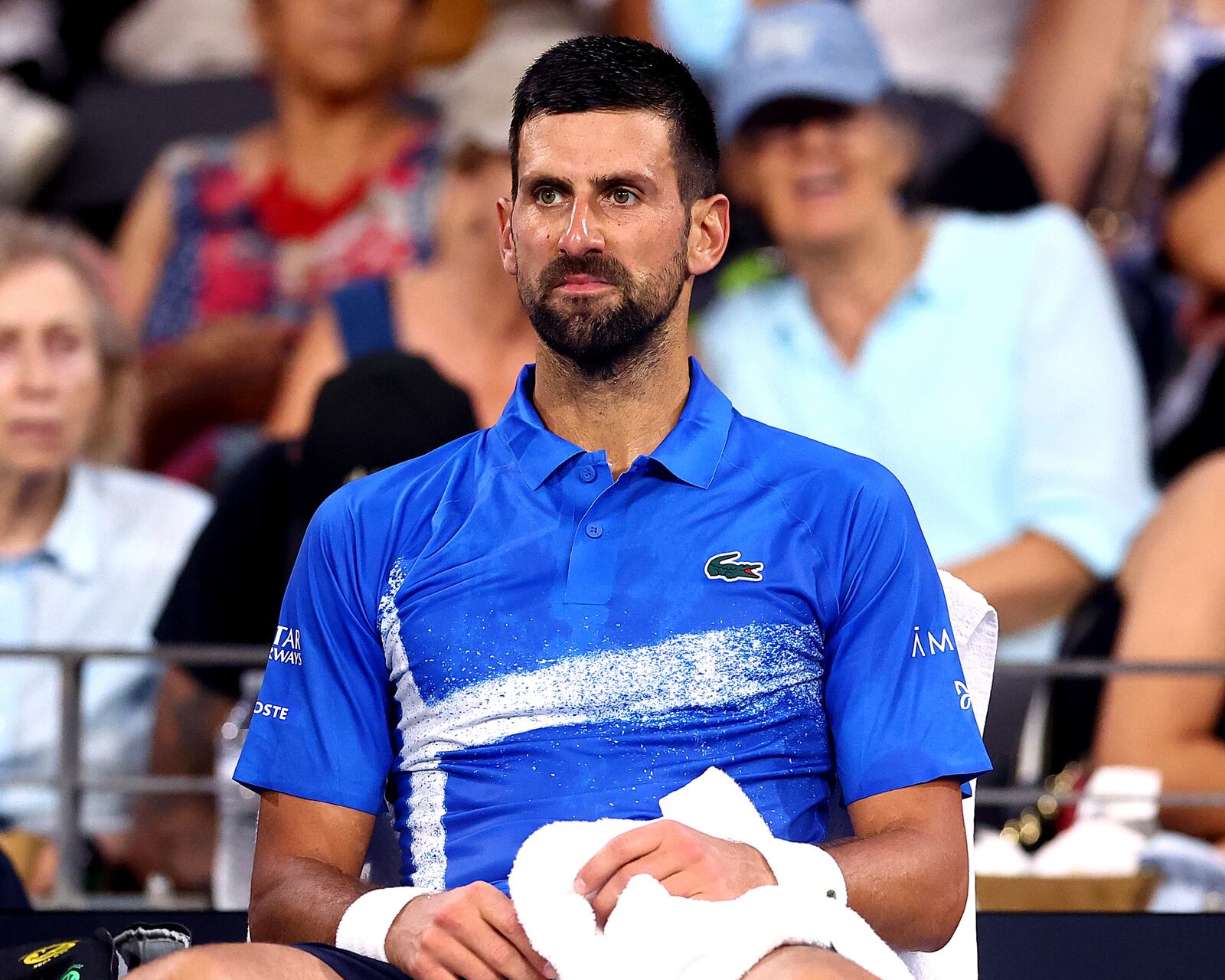 Serbia's Novak Djokovic looks on during his match against USA's Reilly Opelka at the Brisbane International, in Brisbane, Australia, Friday, Jan. 3, 2025. (AP Photo/Pat Hoelscher)