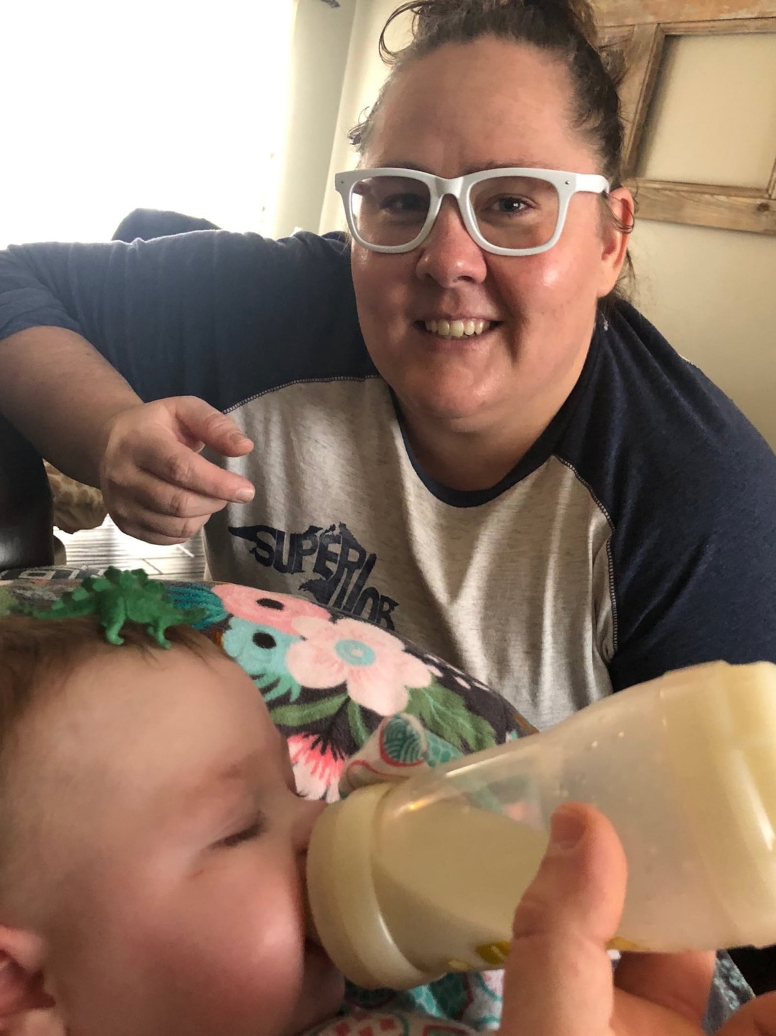 Villagers in Yellow Springs have made more than 1,200 mask to help stop the spread of coronavirus. Pictured: Katie Rose Wright and her niece Charlotte Wright.