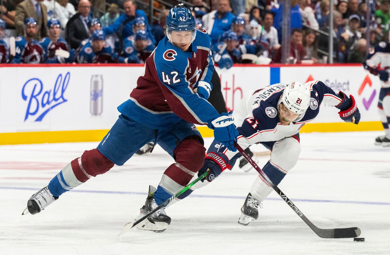 Colorado Avalanche defenseman Josh Manson (42) battles Columbus Blue Jackets left wing James van Riemsdyk (21) for the puck during the second period of an NHL hockey game, Saturday, Oct. 12, 2024, at Ball Arena in Denver. (Christian Murdock/The Gazette via AP)