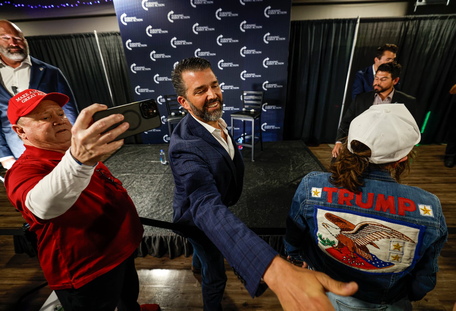 Donald Trump Jr. greets supporters after a town hall meeting Monday, March 17, 2025, in Oconomowoc, Wis. (AP Photo/Jeffrey Phelps)