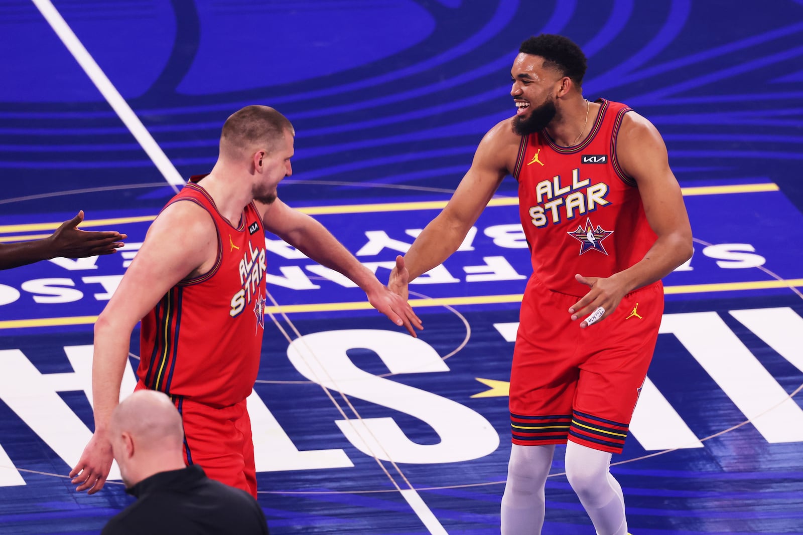 Denver Nuggets center Nikola Jokic, left, shakes hands with New York Knicks center Karl-Anthony Towns during the NBA All-Star basketball game Sunday, Feb. 16, 2025, in San Francisco. (AP Photo/Jed Jacobsohn)