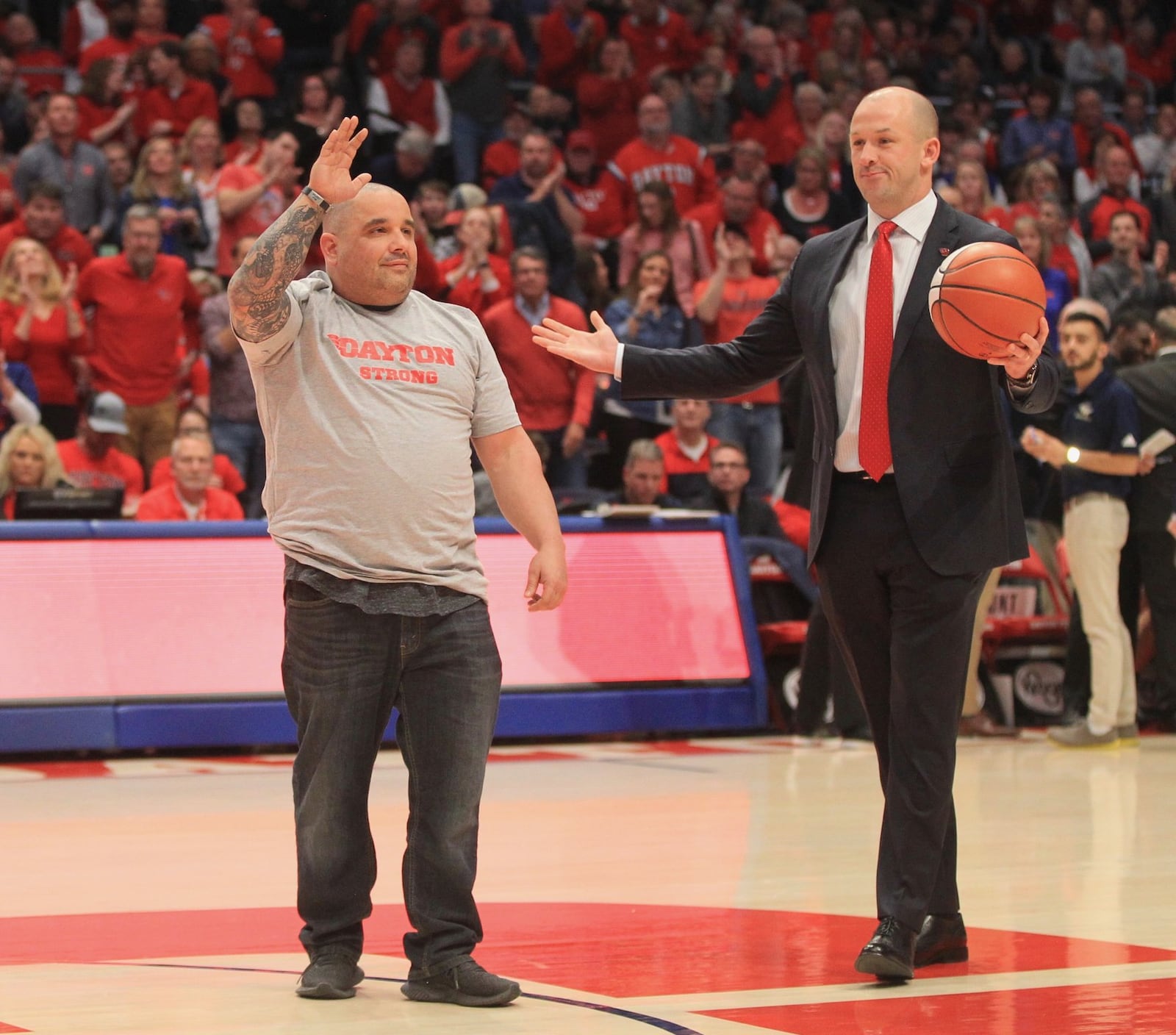 Jeremy Ganger is honored during a game between Dayton and George Washington on Saturday, March 7, 2020, at UD Arena. David Jablonski/Staff