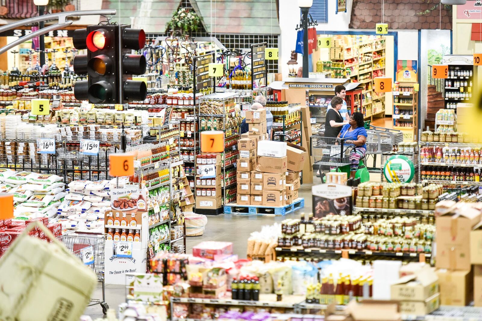 Customers shop at Jungle Jim’s International Market Friday, July 6 in Fairfield. NICK GRAHAM/STAFF