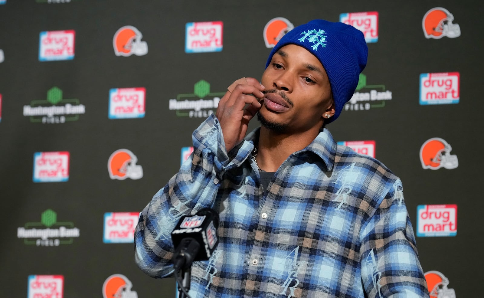 Cleveland Browns quarterback Dorian Thompson-Robinson reacts during a news conference after an NFL football game against the Miami Dolphins Sunday, Dec. 29, 2024, in Cleveland. (AP Photo/Sue Ogrocki)