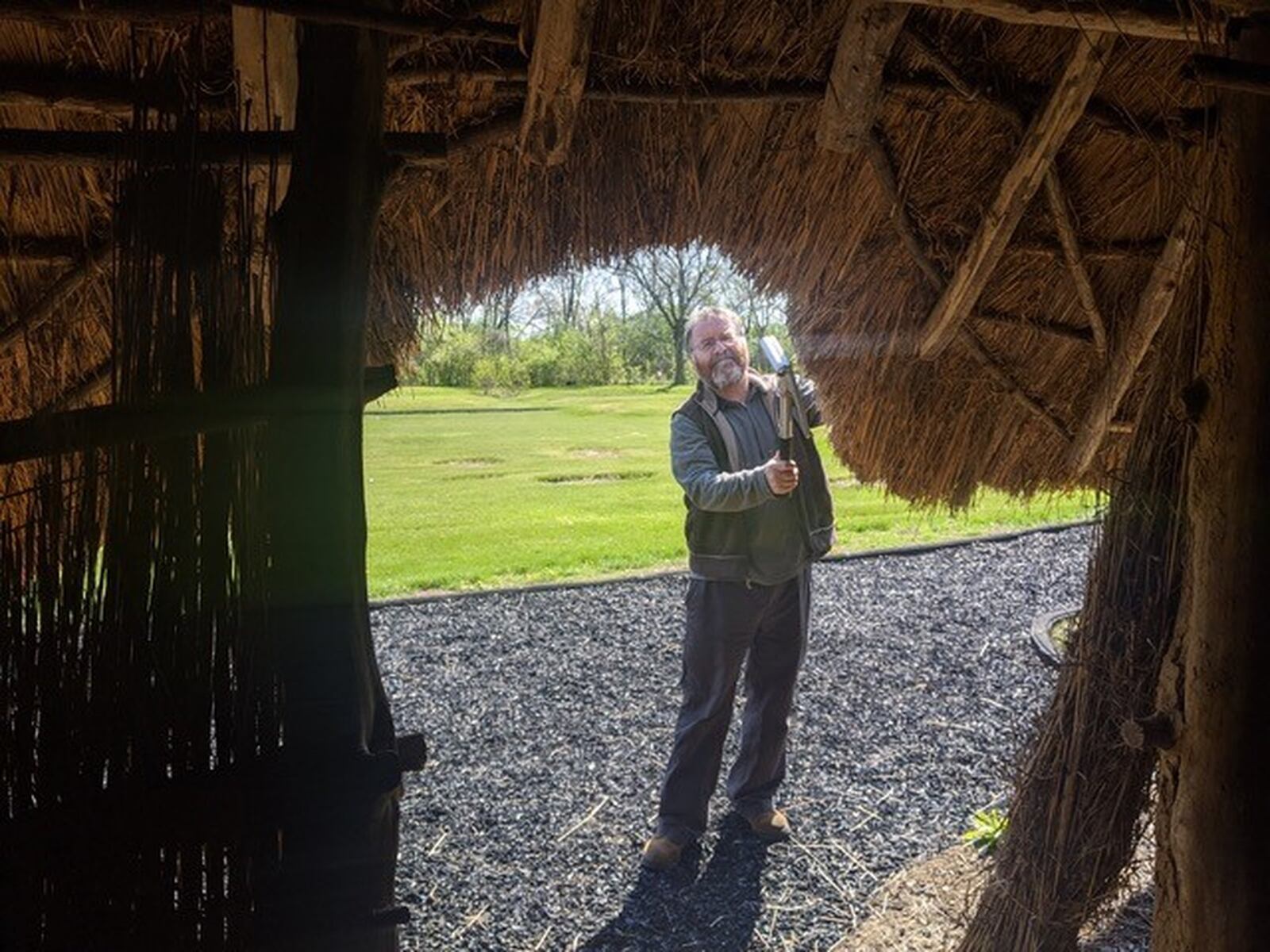 Thatcher William Cahill has spent 10 days at SunWatch repairing the roofs on structures. CONTRIBUTED