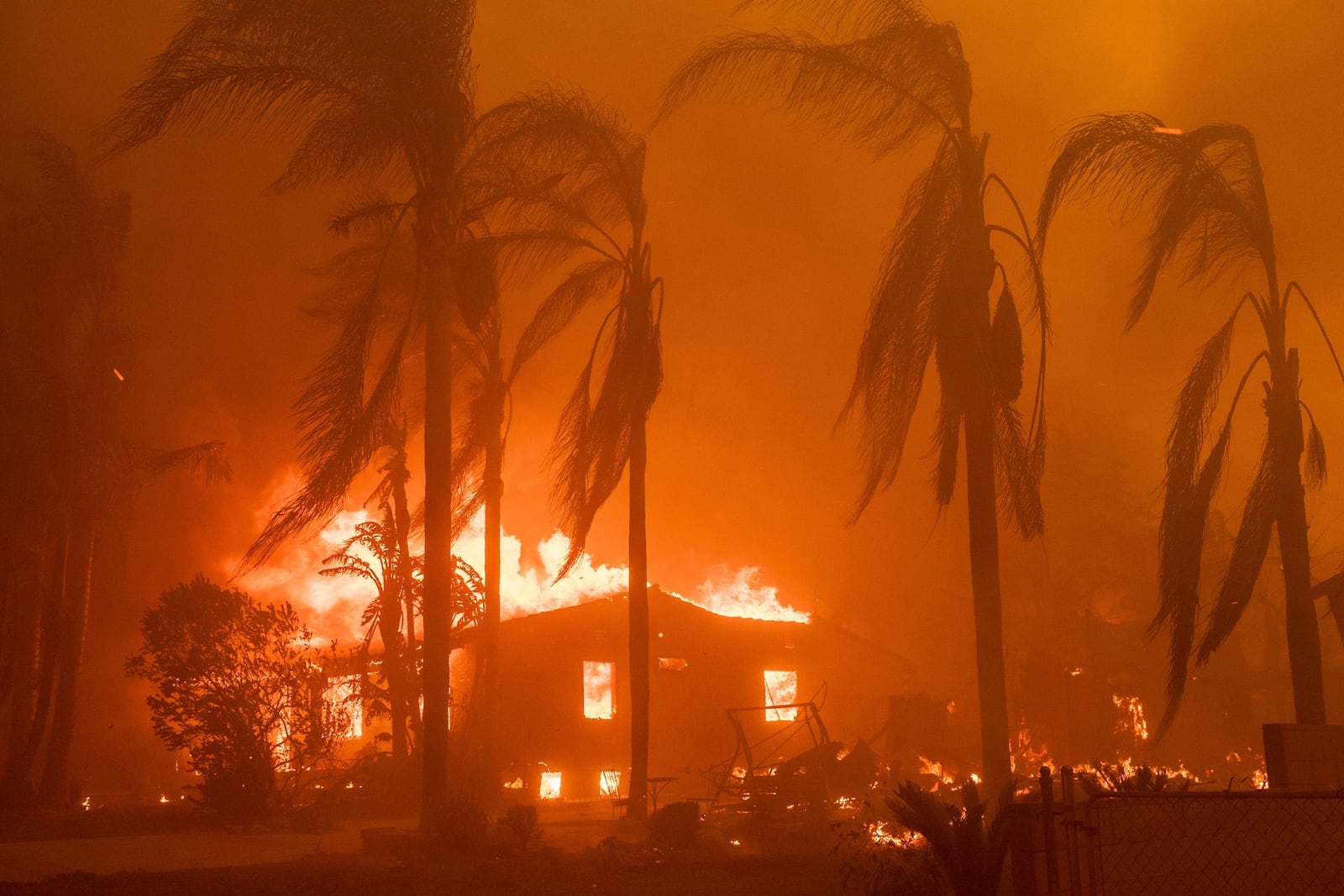 FILE - A home burns in the Eaton Fire in Altadena, Calif., Jan. 8, 2025. (AP Photo/Nic Coury, File)