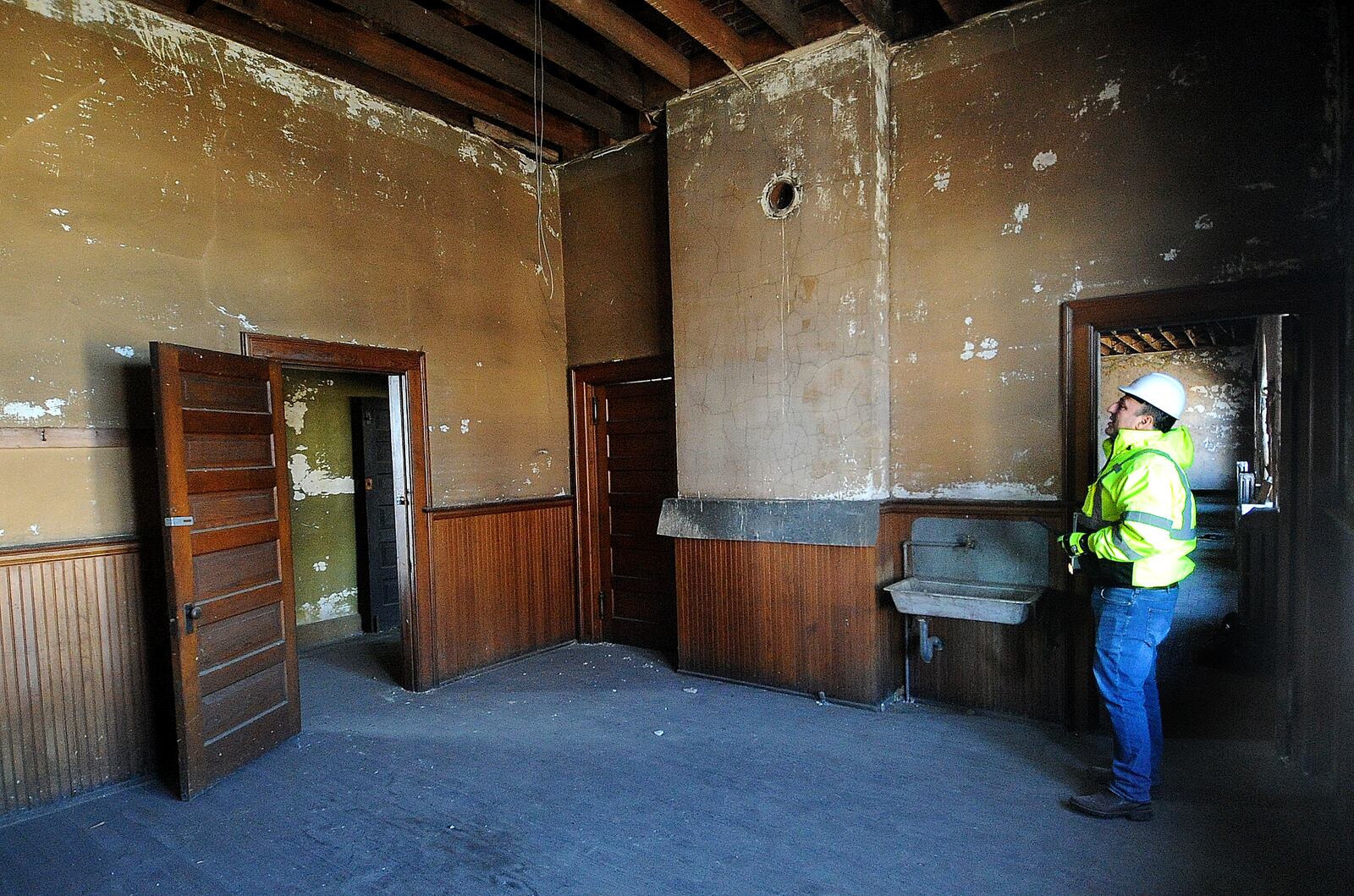 Ben Sutherly gives a tour Wednesday, Feb. 14, 2024 inside the controversial Troy Tavern/IOOF building, which the Troy Historic Preservation Alliance is trying to save. MARSHALL GORBY\STAFF