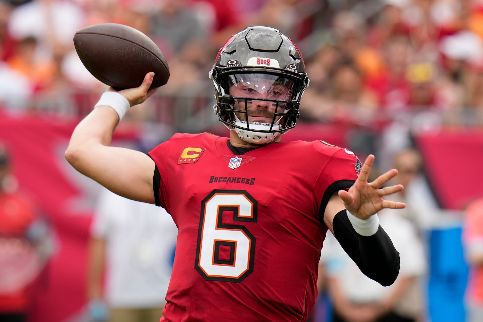 Tampa Bay Buccaneers quarterback Baker Mayfield passes for a touchdown against the Carolina Panthers during the first half of an NFL football game Sunday, Dec. 29, 2024, in Tampa, Fla. (AP Photo/Chris O'Meara)