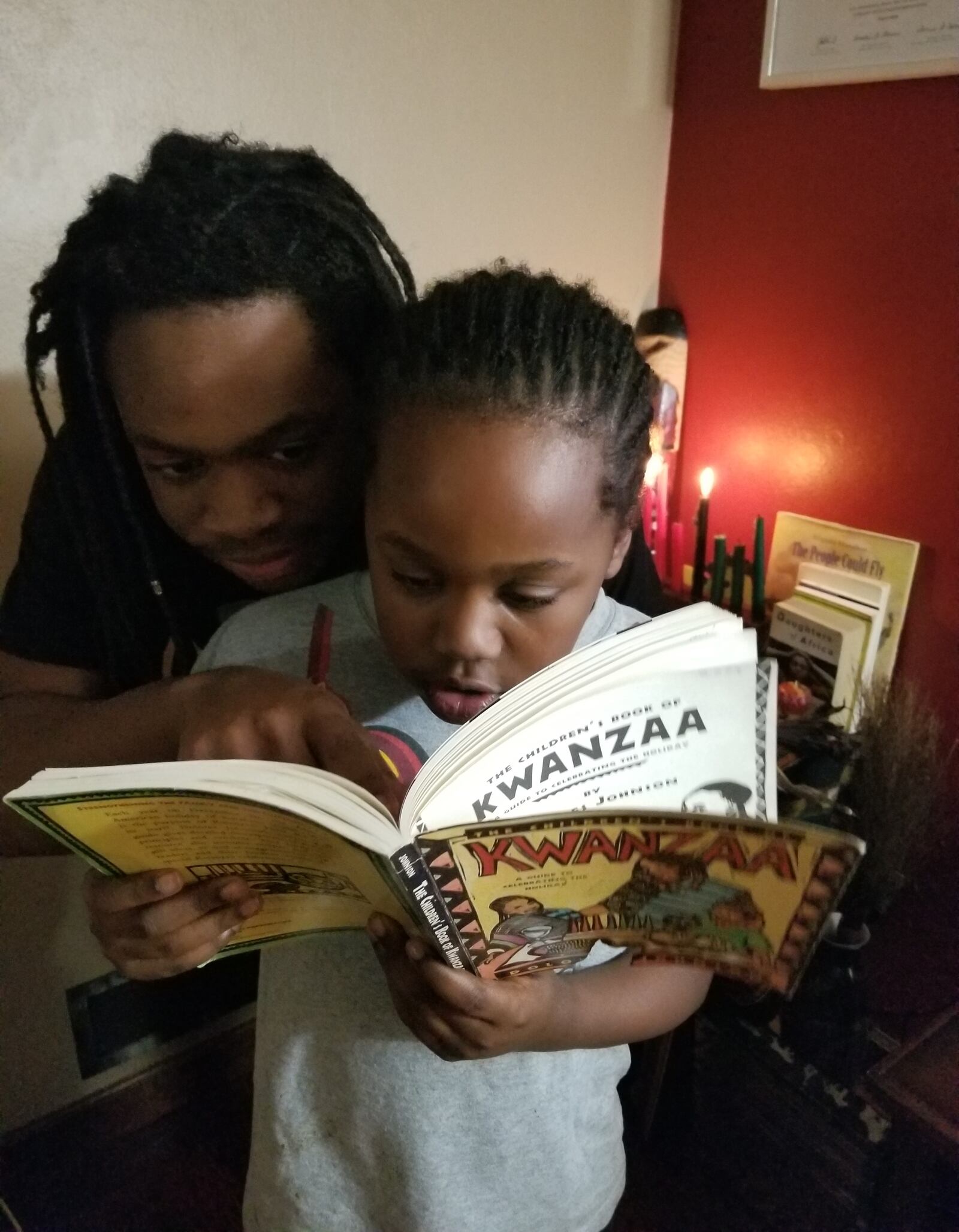 Lucy "Sierra Leone" and Robert Owens celebrate  Kwanzaa with their sons Nesta and Winston (pictured).