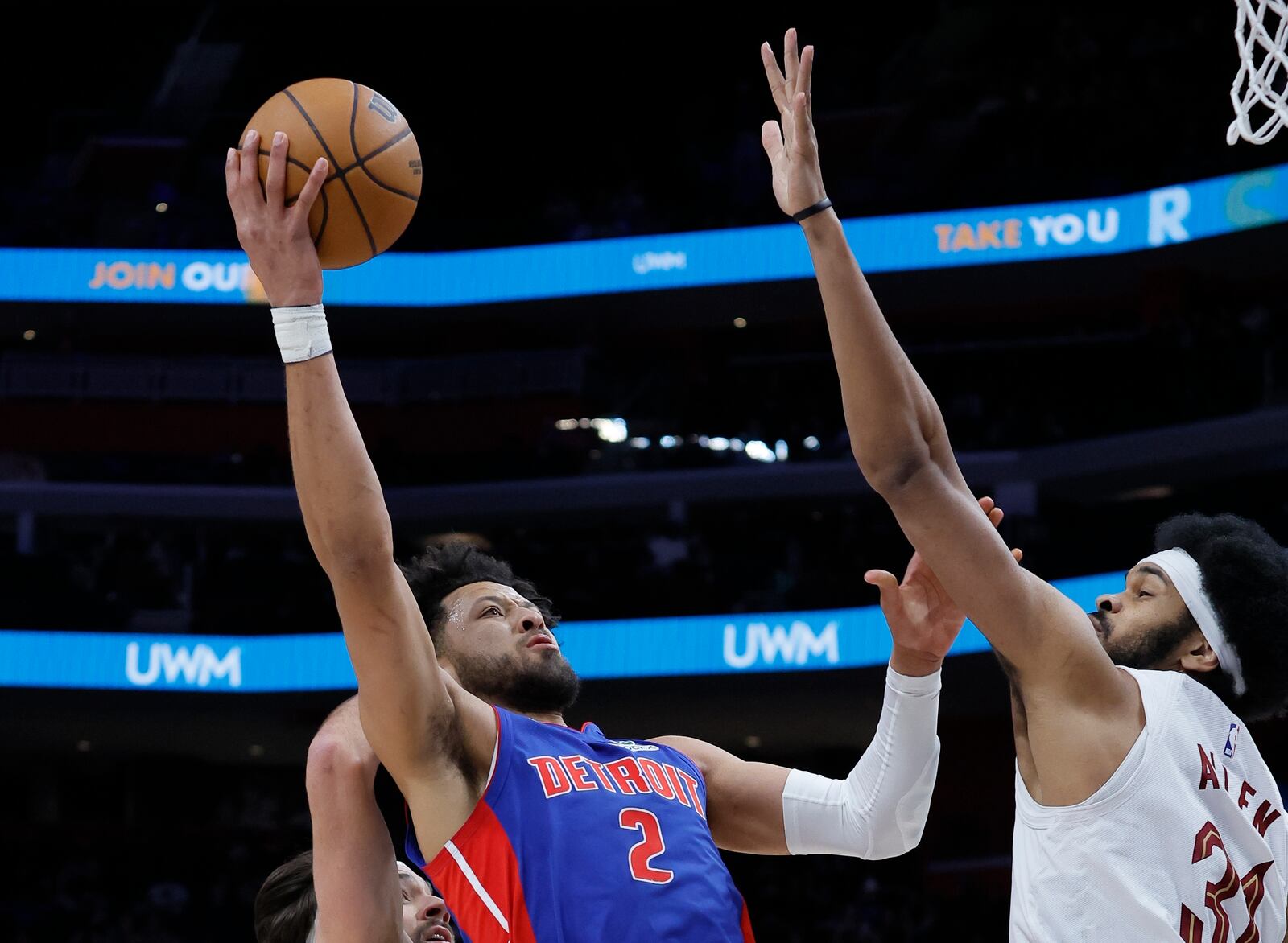 Detroit Pistons guard Cade Cunningham (2) takes a shot against Cleveland Cavaliers center Jarrett Allen (31) during the first half of an NBA basketball game Wednesday, Feb. 5, 2025, in Detroit. (AP Photo/Duane Burleson)