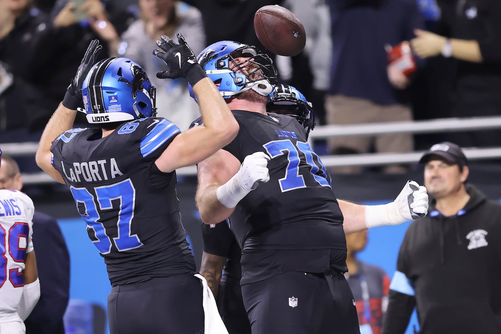 Detroit Lions offensive tackle Dan Skipper, right, celebrates with tight end Sam LaPorta (87) after scoring against the Buffalo Bills during the first half of an NFL football game, Sunday, Dec. 15, 2024, in Detroit. (AP Photo/Rey Del Rio)