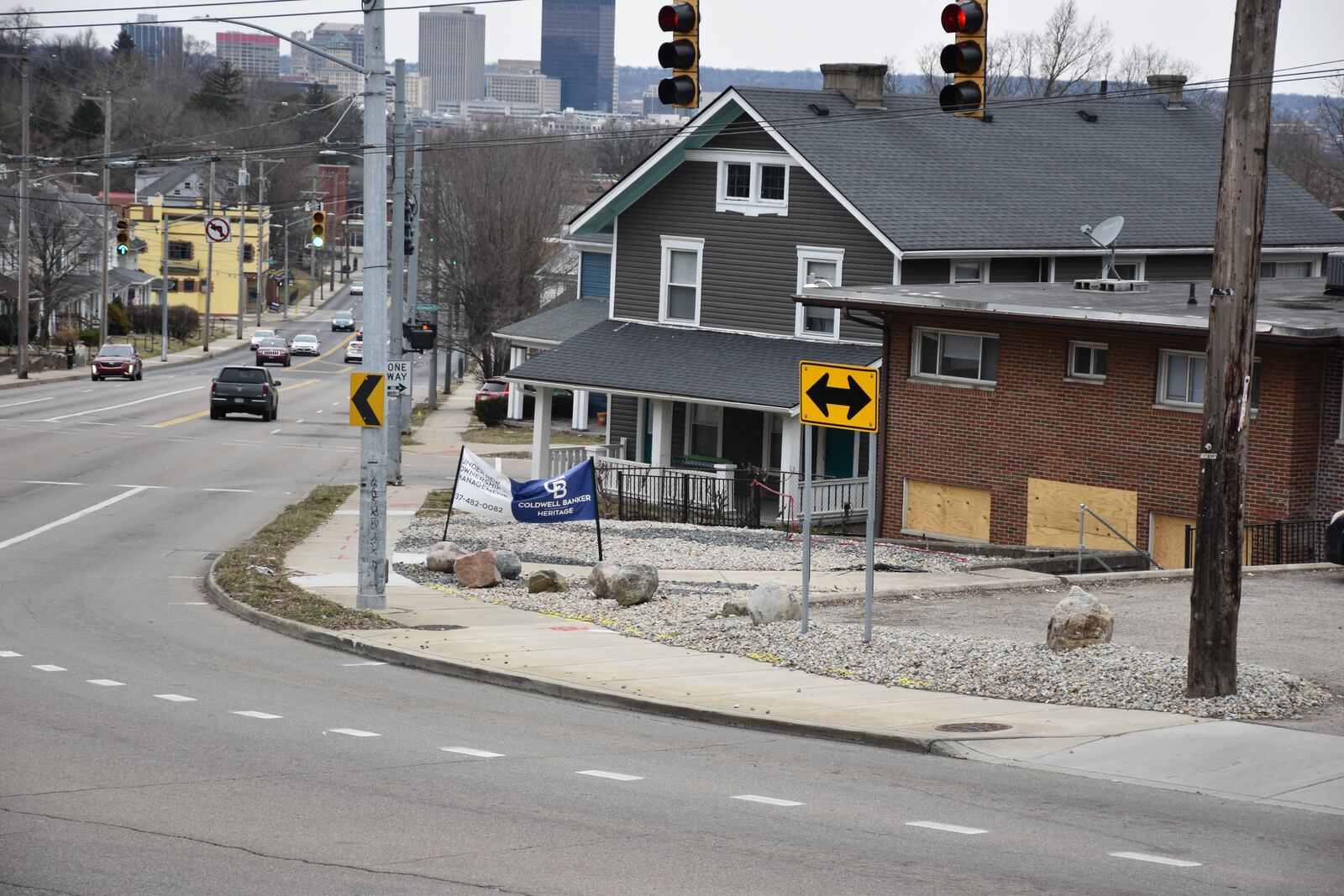 Traffic signs in front of an apartment building at 2308 Wayne Ave. in southeast Dayton, which has been struck multiple times by vehicles, causing injuries and damage. CORNELIUS FROLIK / STAFF