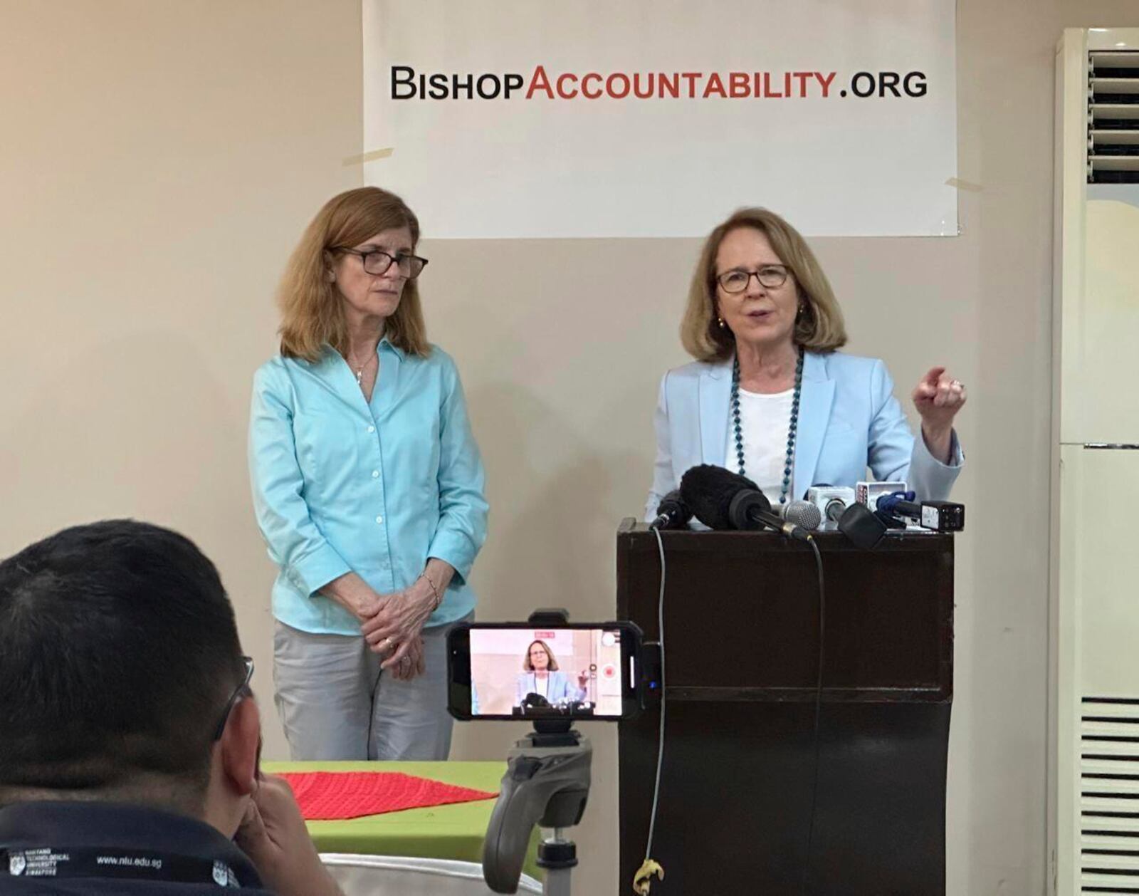 Anne Barrett Doyle, right, Co-Director and Suzy Nauman, database manager of BishopAccountability.org, a United States-based watchdog, speaks at a news conference in Manila on Jan.29, 2025 where they launched an online database on more than 80 Roman Catholic priests who have been accused of sexually abusing minors in the Philippines. (AP Photo/Joeal Calupitan)