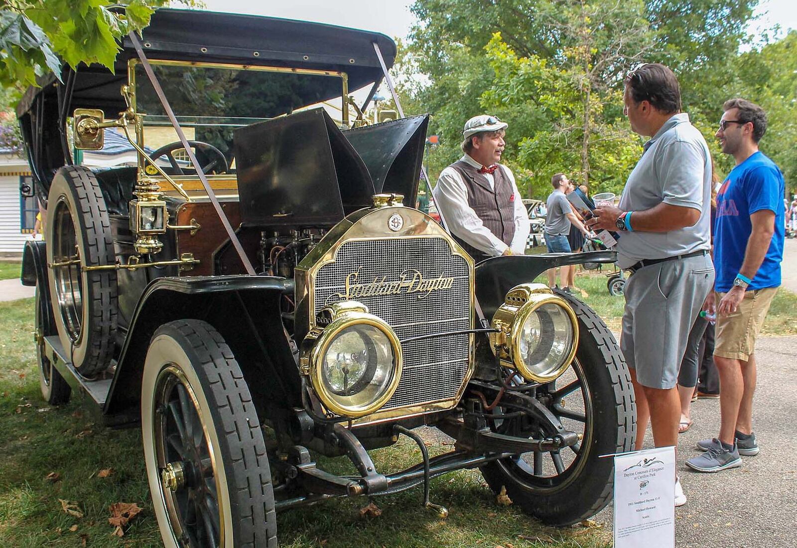 Michael Howard of Scotts, Michigan, wearing cap, talks about his 1911 Stoddard-Dayton to spectators during the Dayton Concours. The car was built in Dayton. Photo by Haylie Schlater