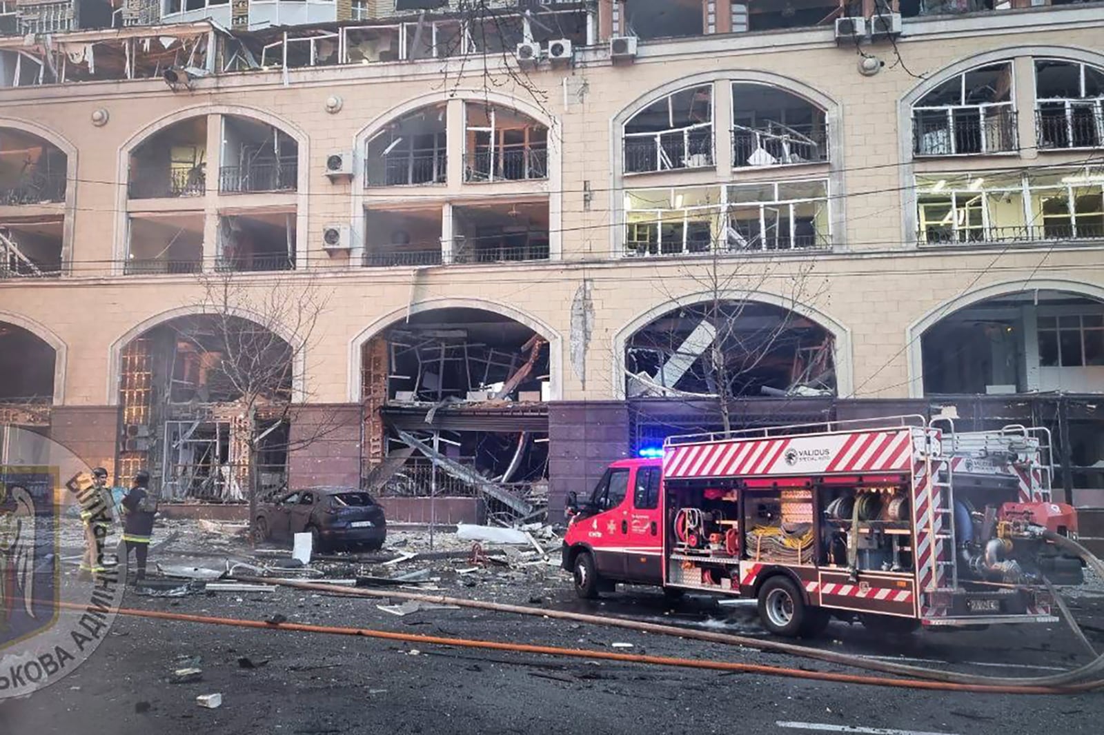 In this photo provided by Kyiv city's military administration, firefighters work on the site after a Russian missile attack in Kyiv, Ukraine, Friday, Dec. 20, 2024. (Kyiv city's military administration via AP)