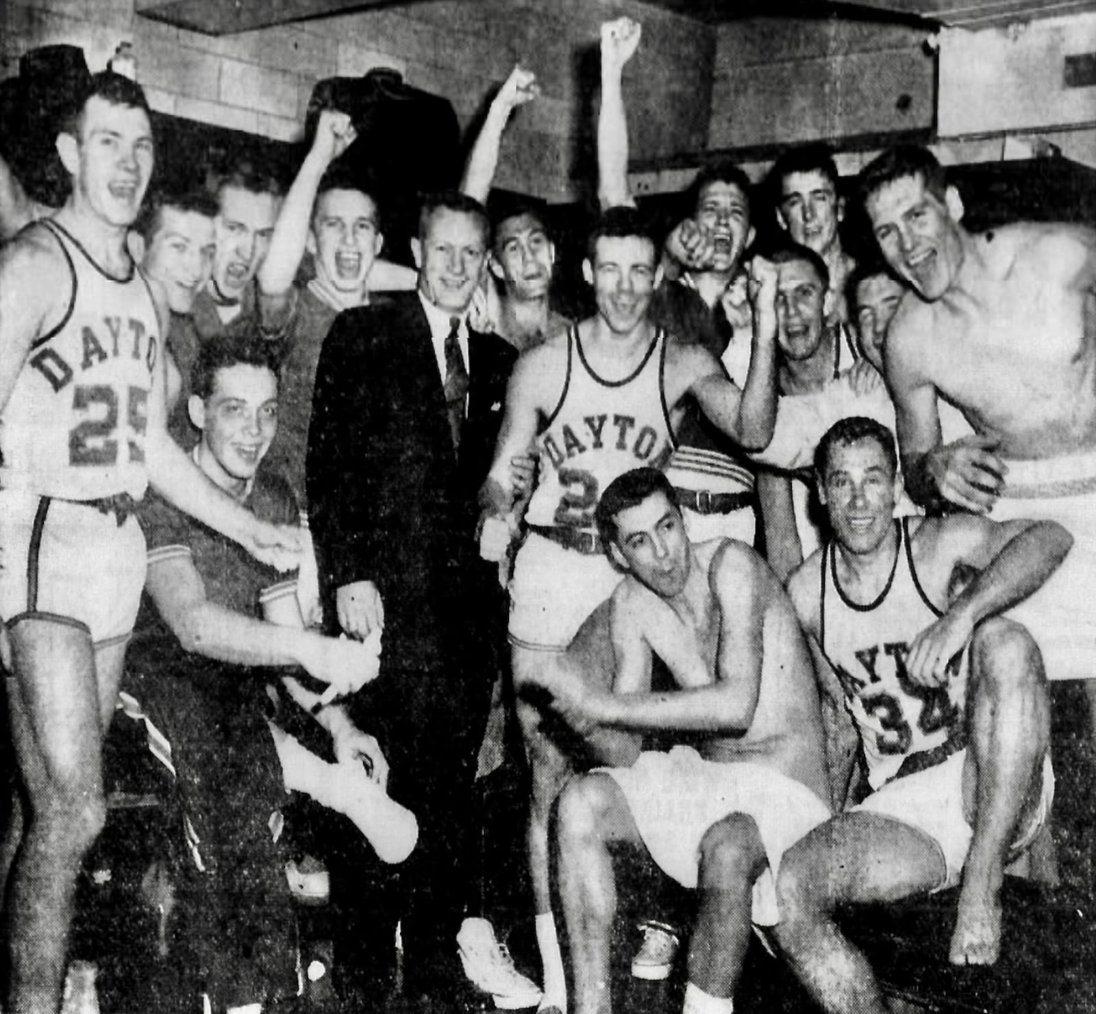 Dayton celebrates after a victory against No. 4 Duquesne on Feb. 26, 1955, in Dayton. Daily Daily News photo