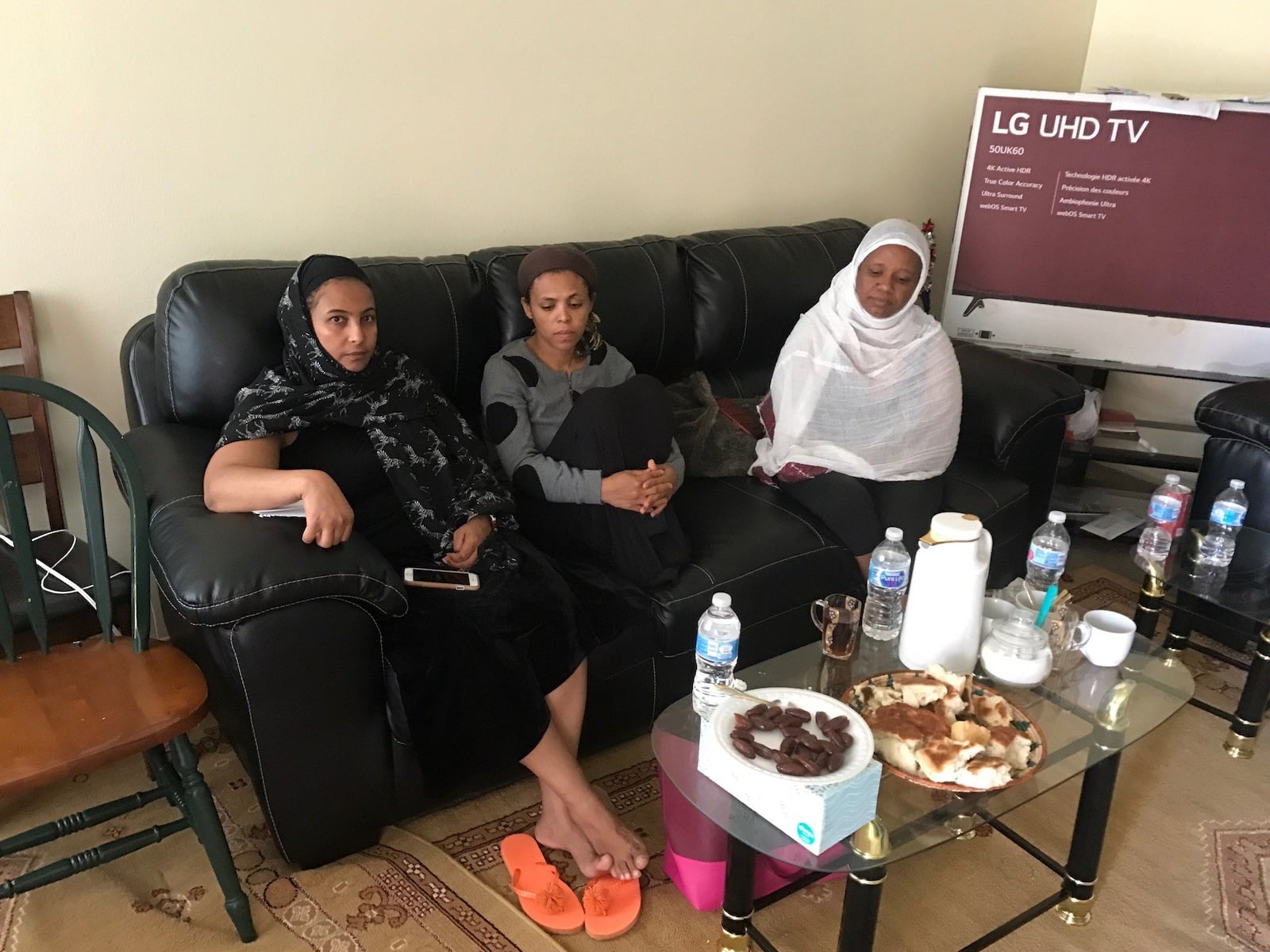 Gathered at Saeed Saleh’s home on Southshore Drive off Old Troy Pike, Monday were (left) Senait Mebratu, the sister of Zaid s wife Zaid Senait, Saeed s wife Zaid Nuguse Eseyas and xxx. TOM ARCHDEACON/STAFF