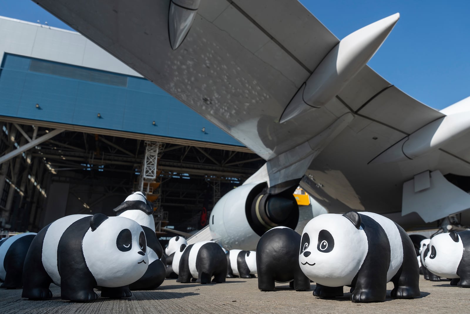 Part of 2500 panda sculptures are displayed at the Hong Kong International Airport during a welcome ceremony of the panda-themed exhibition "Panda Go!" in Hong Kong, Monday, Dec. 2, 2024. (AP Photo/Chan Long Hei)