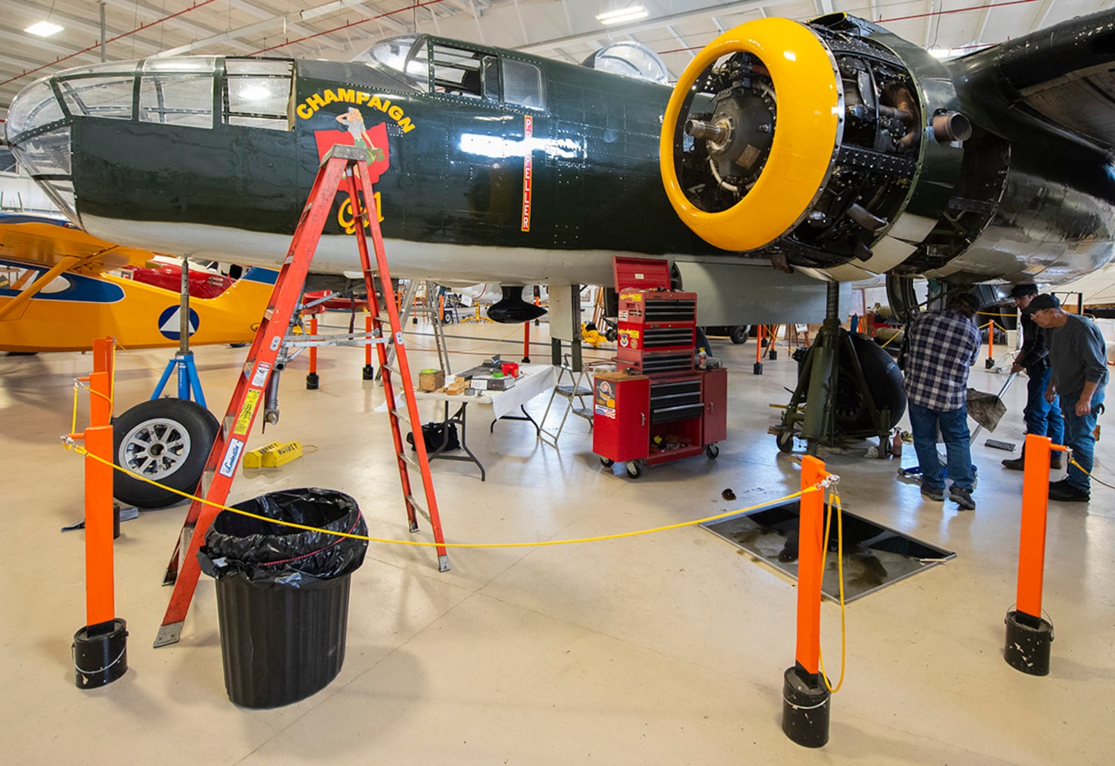 Champaign Gal, a B-25 Mitchell bomber, sits on jack stands in the Champaign Aviation Museum on March 12 in Urbana. Museum staff and volunteers removed the plane’s wheels and main mounts for maintenance. The propellers were removed and sent to Michigan for recertification. U.S. AIR FORCE PHOTO/R.J. ORIEZ