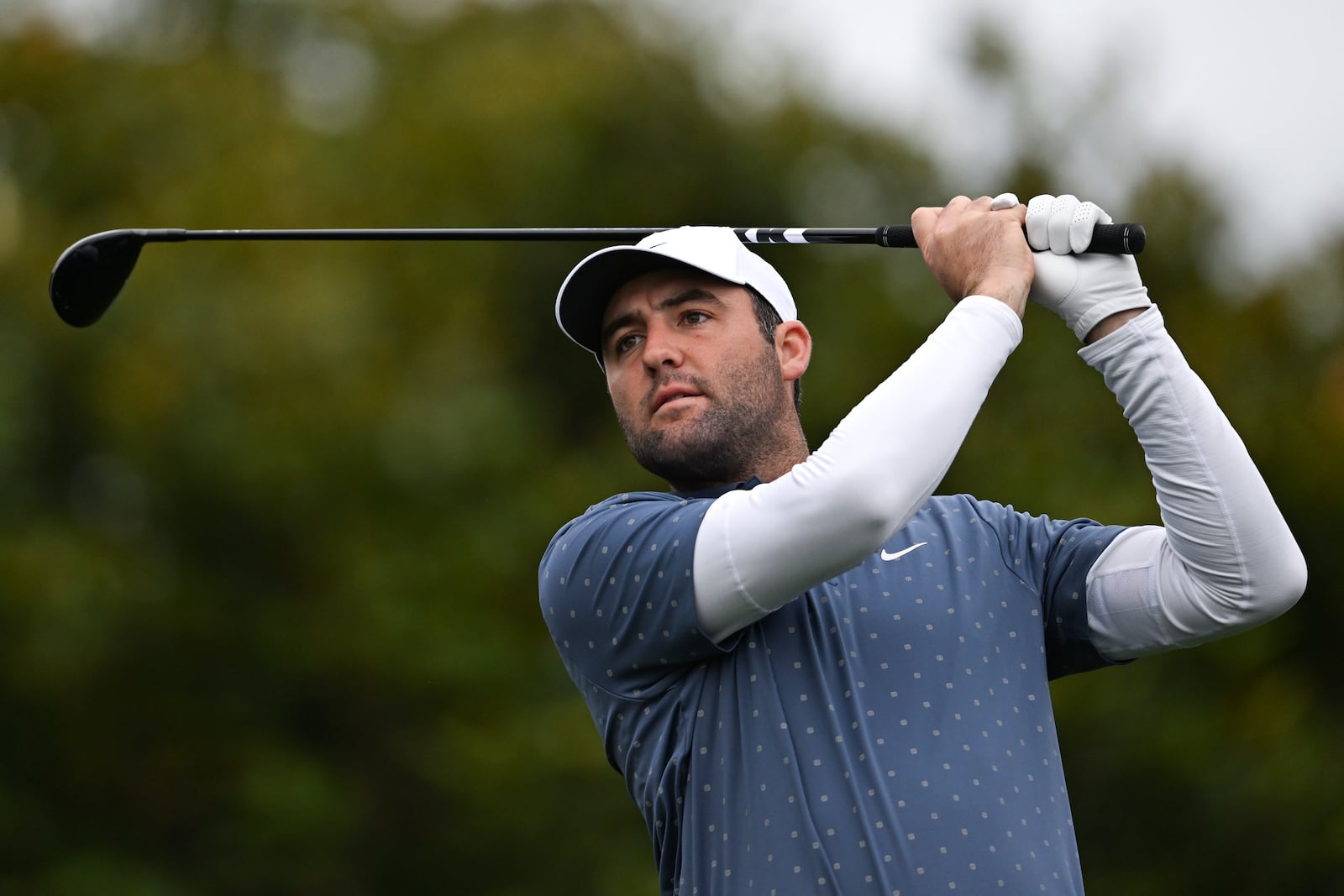 Scottie Scheffler hits his tee shot on the first hole at Pebble Beach Golf Links during the third round of the AT&T Pebble Beach Pro-Am golf tournament, Saturday, Feb. 1, 2025, in Pebble Beach, Calif. (AP Photo/Nic Coury)