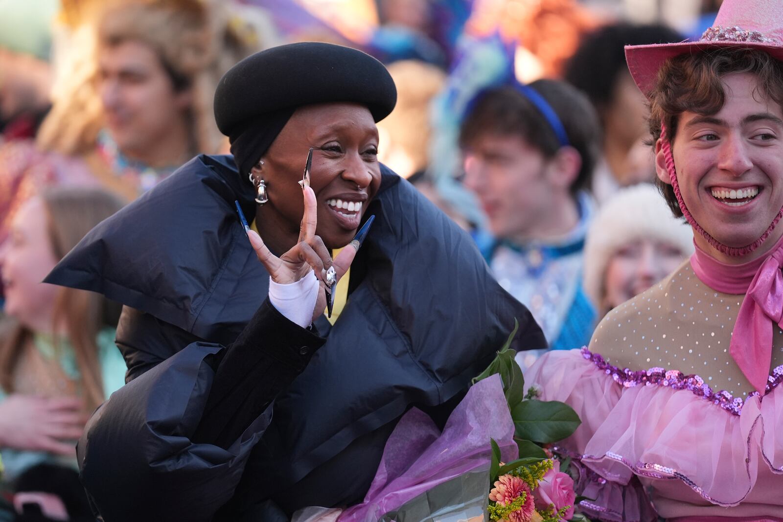 Harvard University's Hasty Pudding Theatricals Woman of the Year Cynthia Erivo gestures to fans during a parade in her honor, Wednesday, Feb. 5, 2025, in Cambridge, Mass. (AP Photo/Charles Krupa)