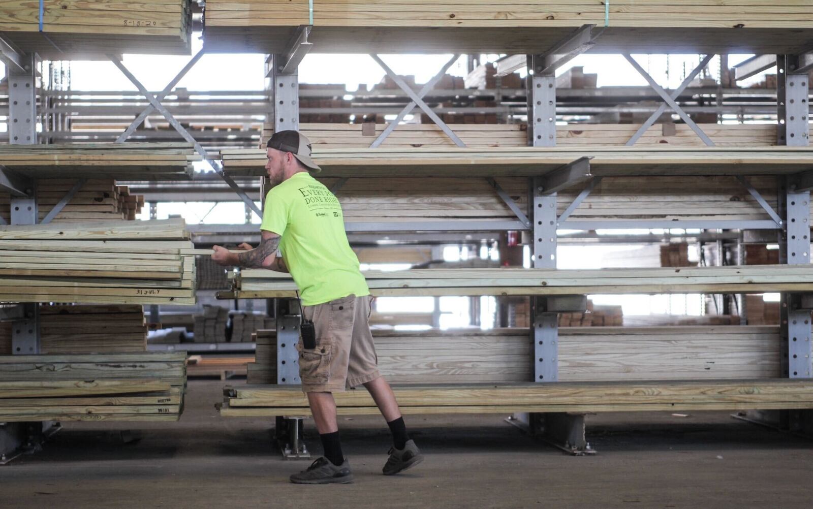 Requarth Company employee Robert Laycox, loads wood in their lumber yard in Dayton on Thursday, August 20, 2020. Alan Pippenger, president of Requarth, said that business was off in March and April but came roaring back by June and July. Jim Noelker/Staff