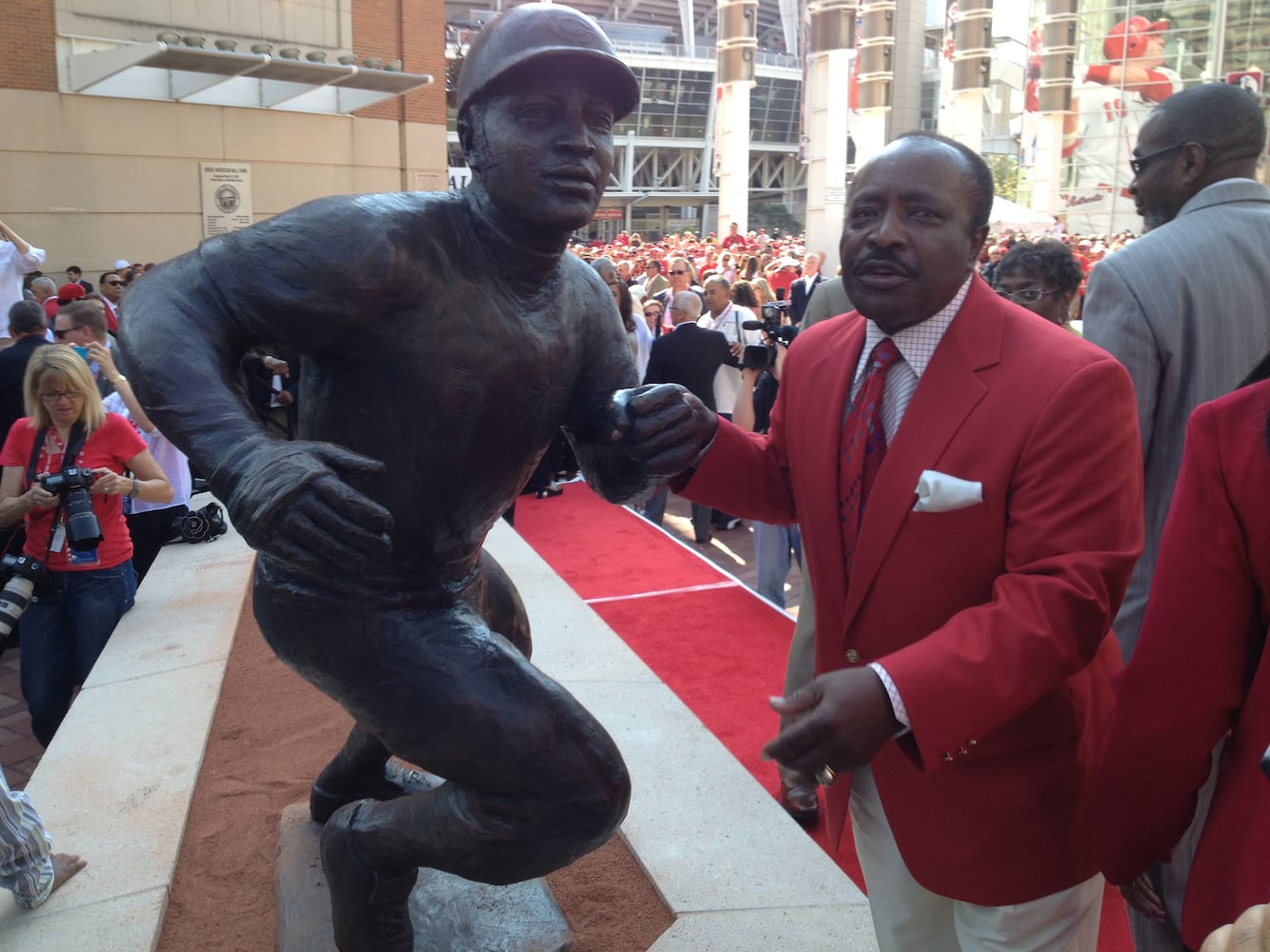 Hall of Famer Joe Morgan stands next to his statue. LOT TAN / STAFF