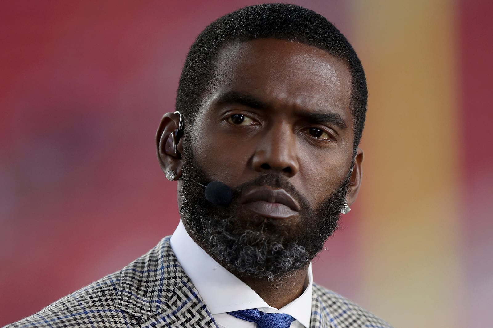 FILE Broadcaster Randy Moss sits on the sideline before an NFL football game between the San Francisco 49ers and the Los Angeles Rams, Monday, Nov. 15, 2021, in Santa Clara, Calif. (AP Photo/Scot Tucker, File)